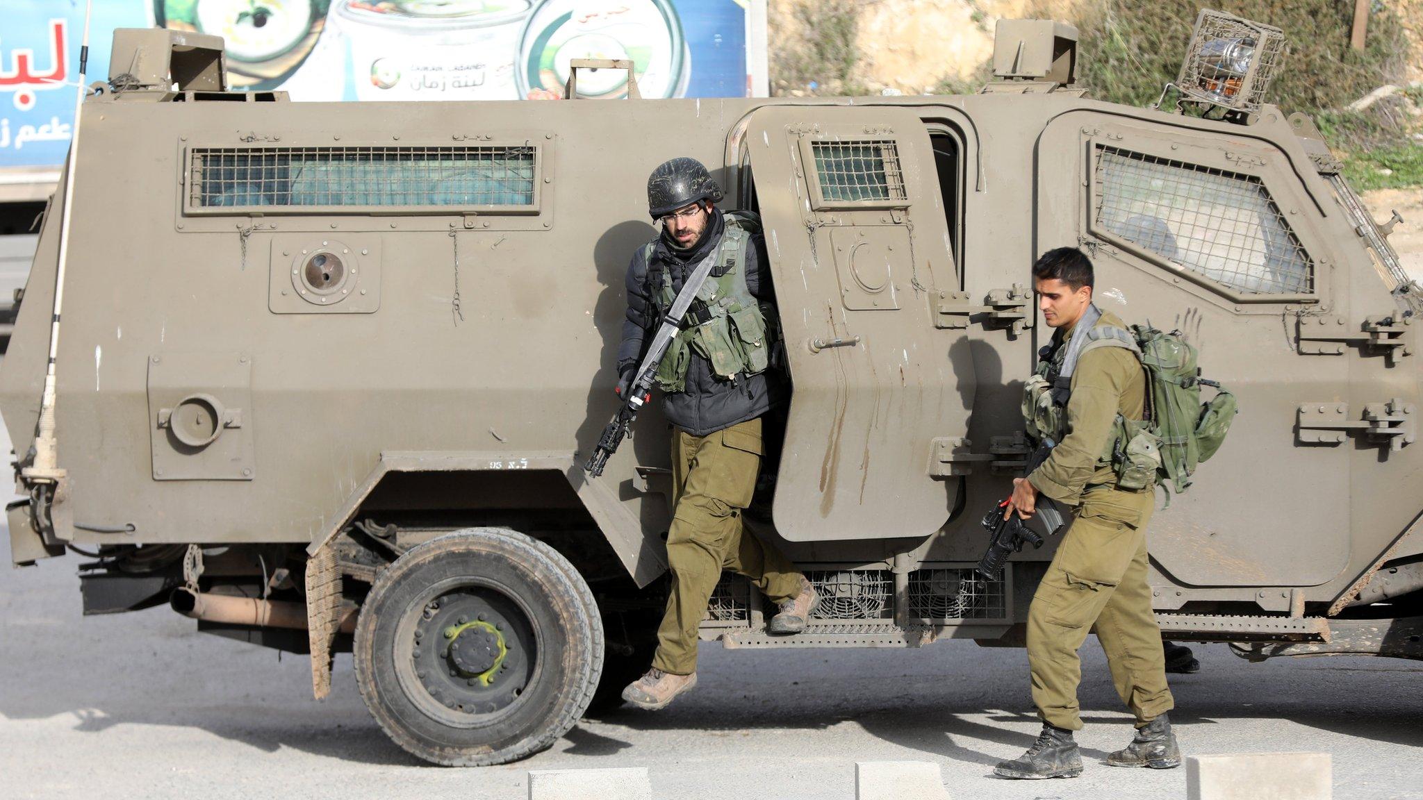 Israeli soldiers search for the killers of an Israeli settler near Nablus in the occupied West Bank on 10 January 2018