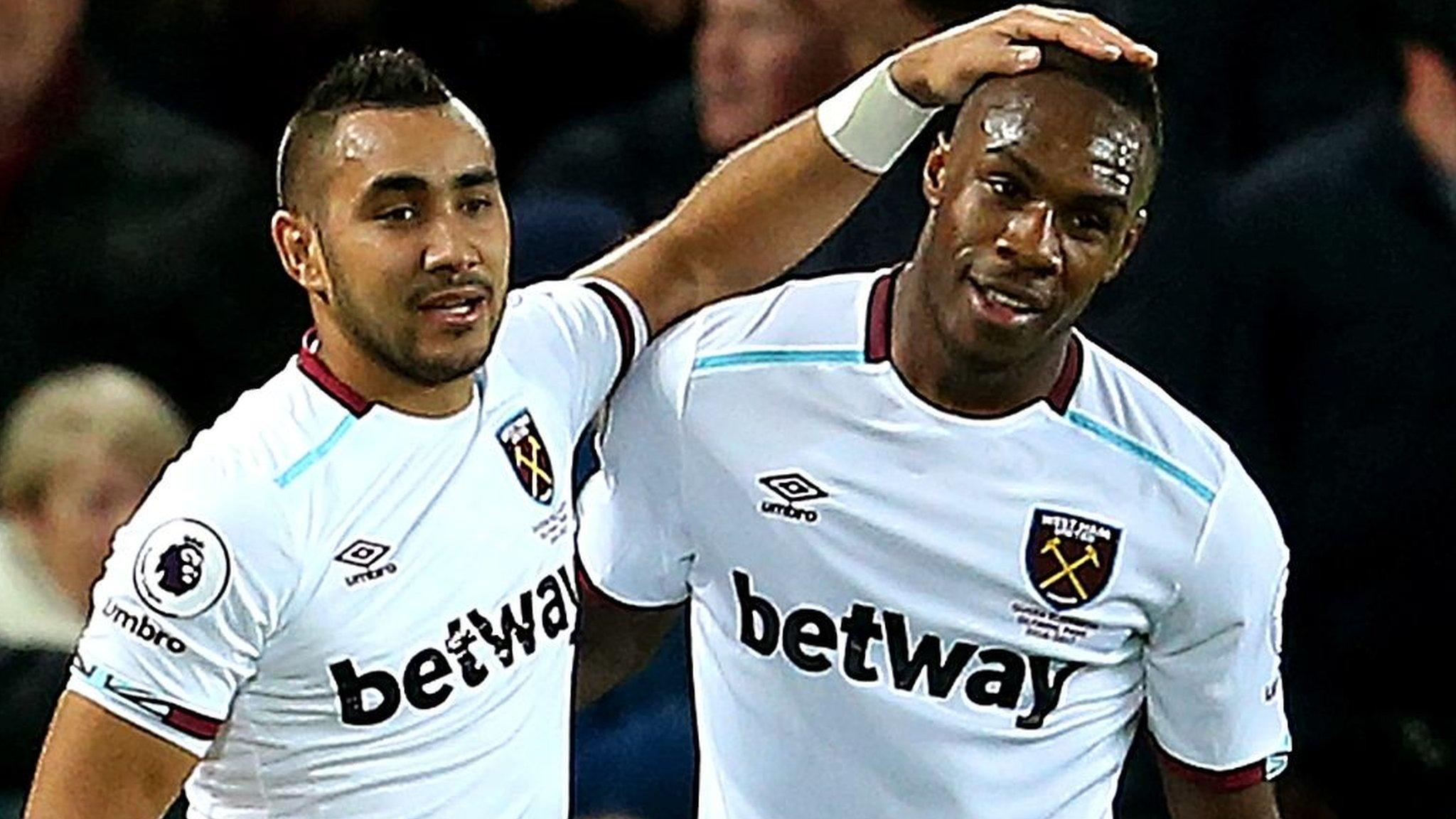 Michail Antonio of West Ham United celebrates with Dimitri Payet