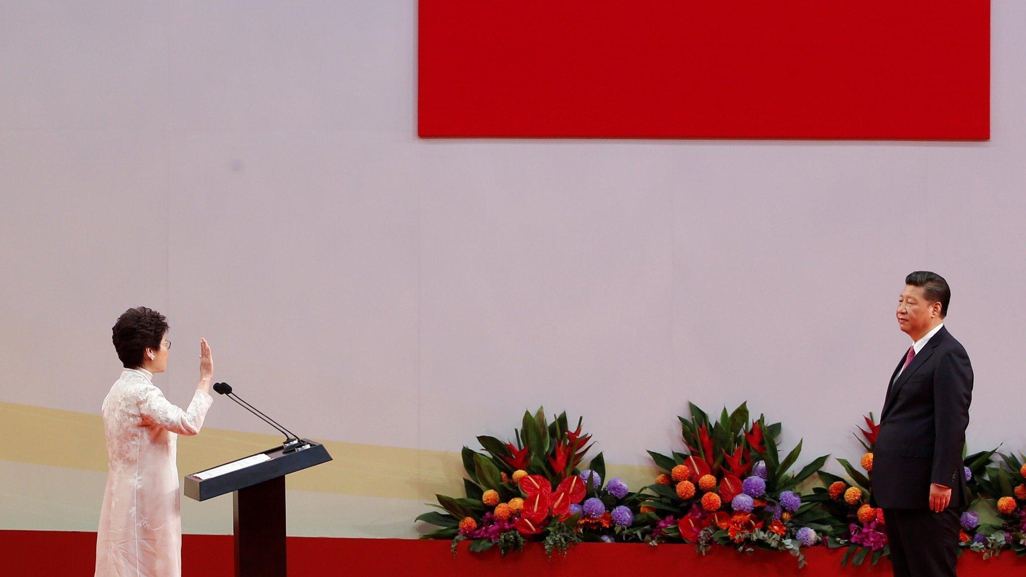 Hong Kong Chief Executive Carrie Lam takes her oath in front of Chinese President Xi Jinping on the 20th anniversary of the city's handover from British to Chinese rule, in Hong Kong, China, July 1, 2017.