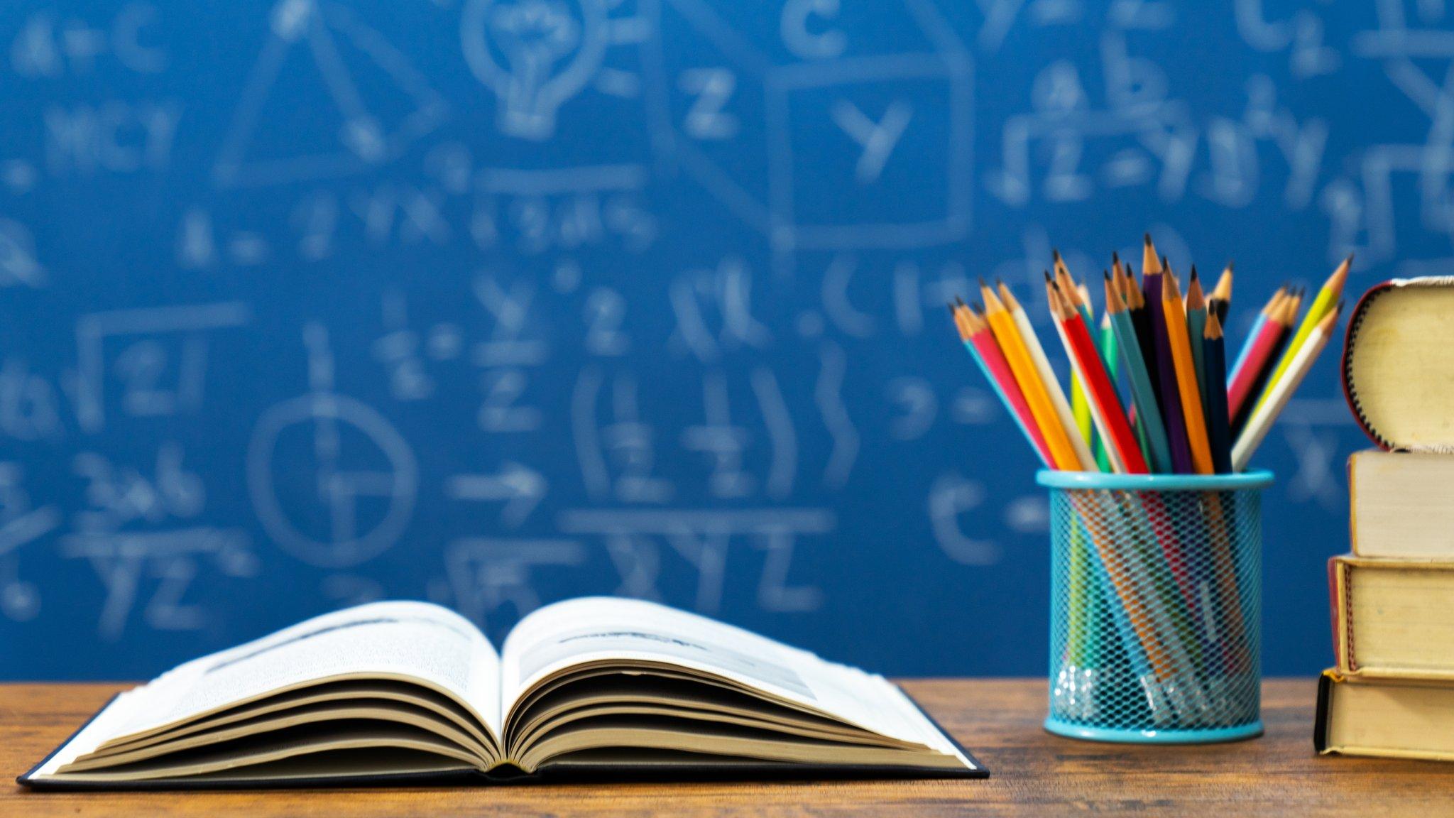 book and pencils in classroom