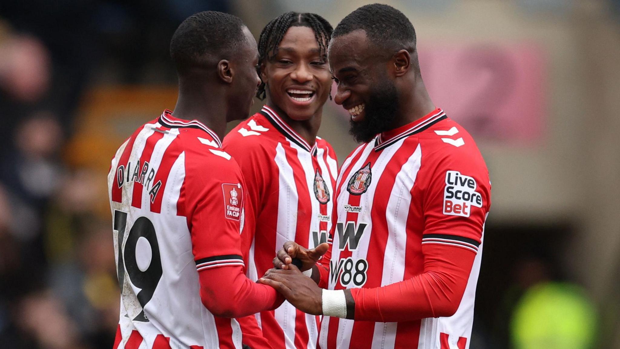 Habib Diarra is congratulated after putting Sunderland ahead from the penalty spot in the FA Cup fourth round tie at Oxford United.