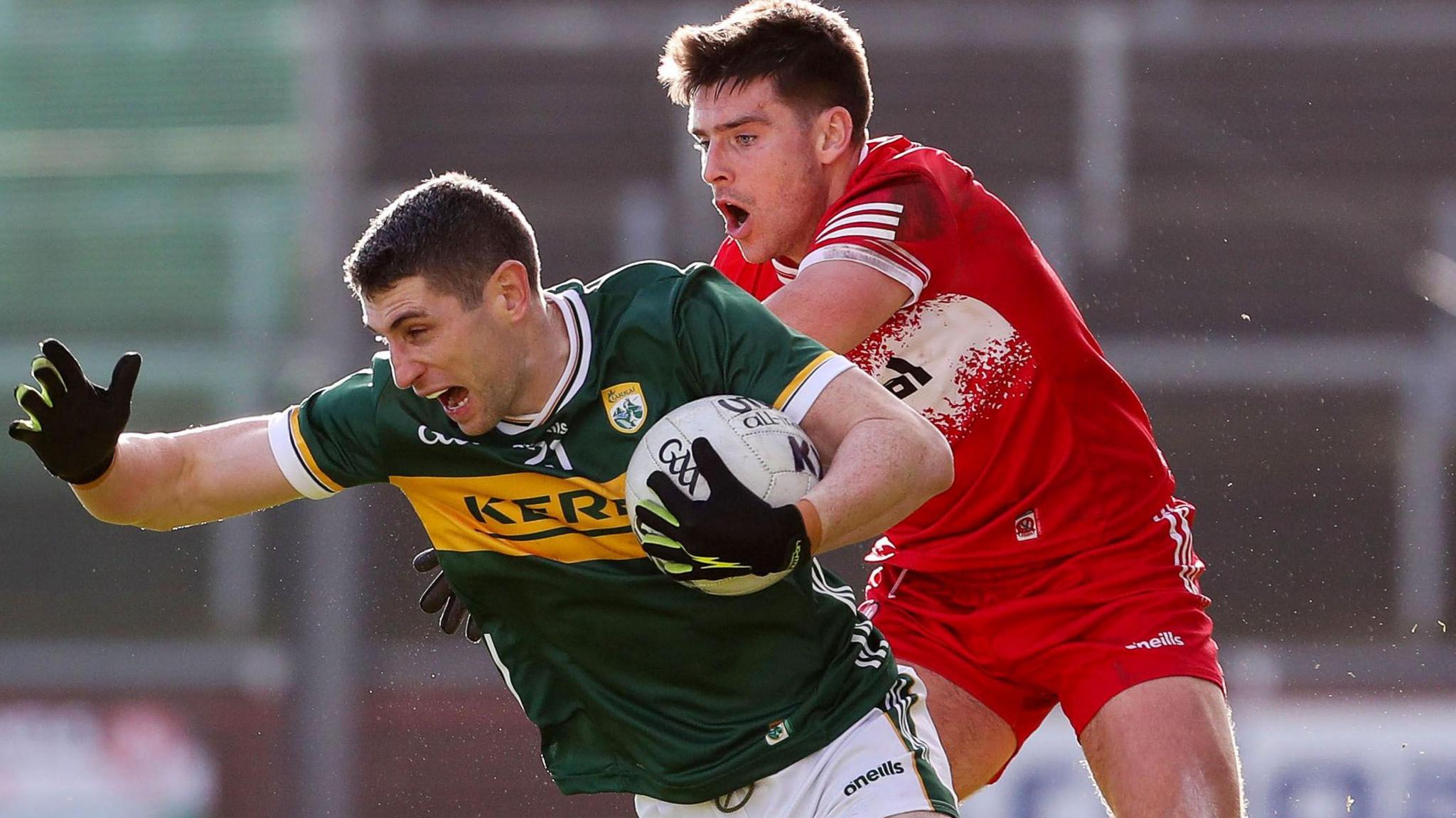 Derry's Conor Doherty attempts to keep pace with Kerry's Paul Geaney at Celtic Park