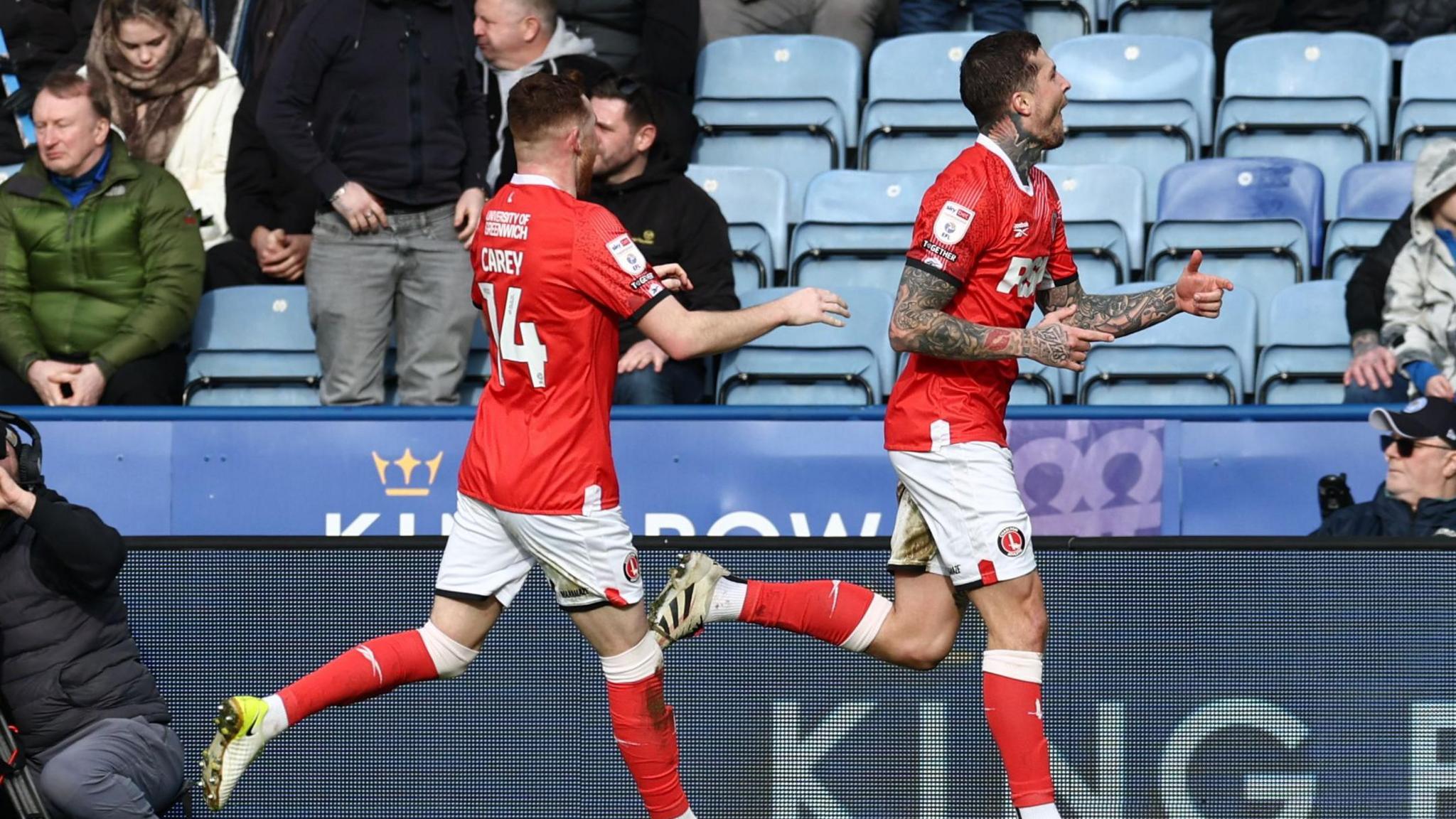 Lyndon Dykes celebrates with Sonny Carey after scoring Charlton's second goal against Leicester.