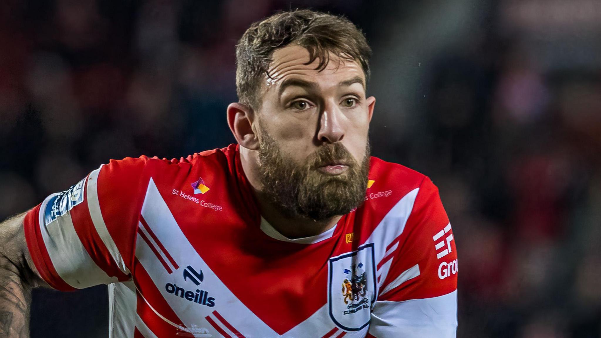 Daryl Clark in a red and white St Helens top with a straight face