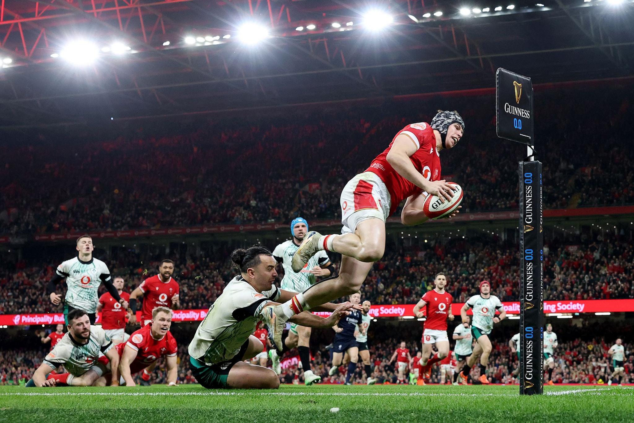 Wales' Tom Rogers scores his team's second try during their Six Nations defeat by Ireland at the Principality Stadium in Cardiff