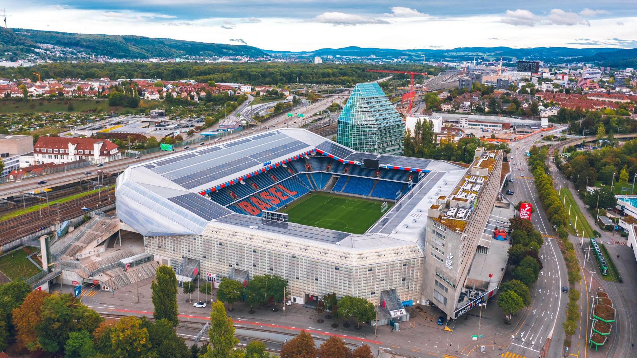 A football stadium with hills behind in the Swiss city of Basel