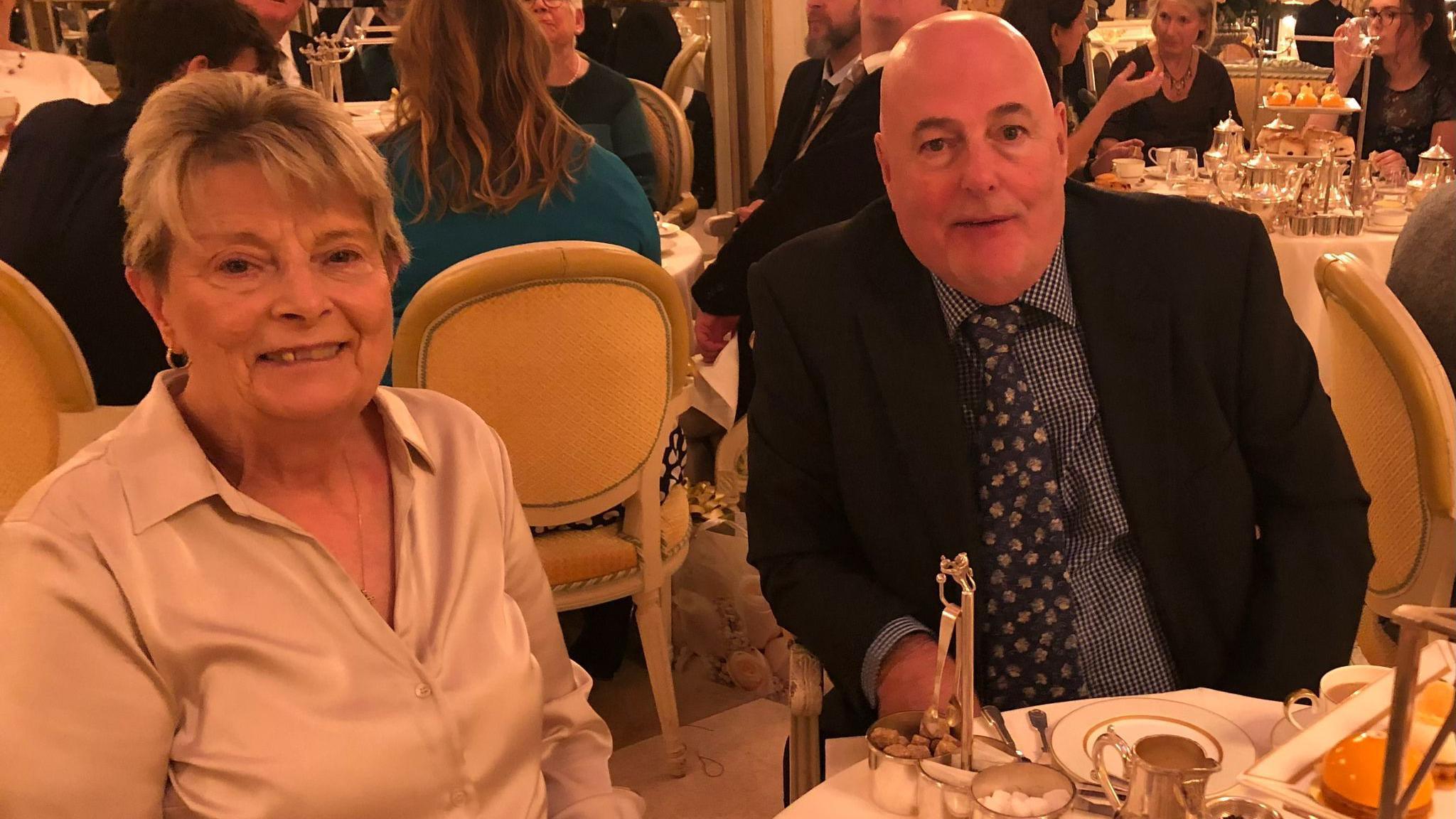 Pat Bailey on the left and her husband David Bailey on the right sat inside the Ritz Hotel in London for their 50th wedding anniversary in 2019