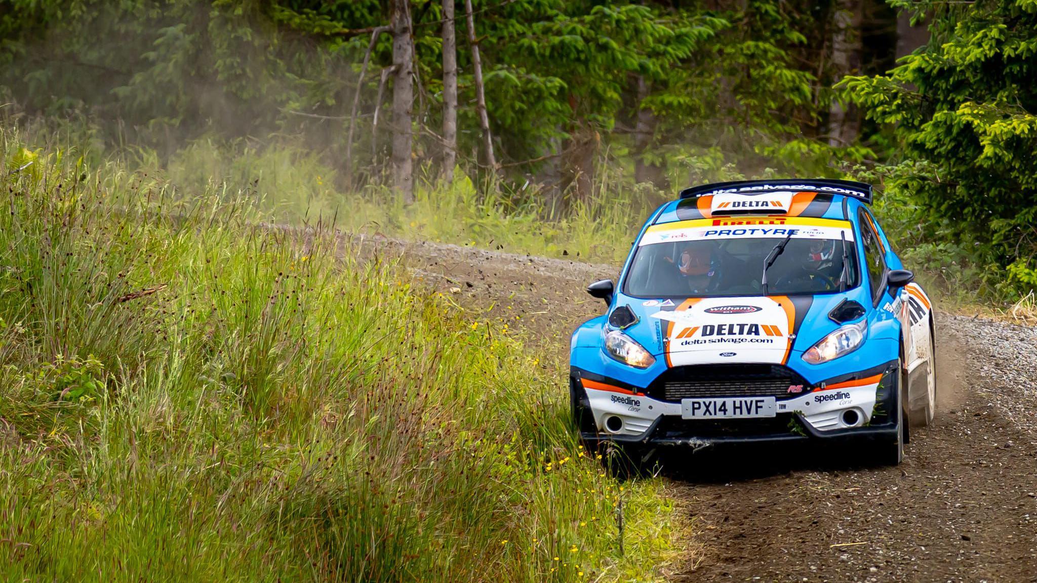 Matthew Hirst and Declan Dear driving a Ford Fiesta en-route to winning the 2024 Kielder Forest Rally.