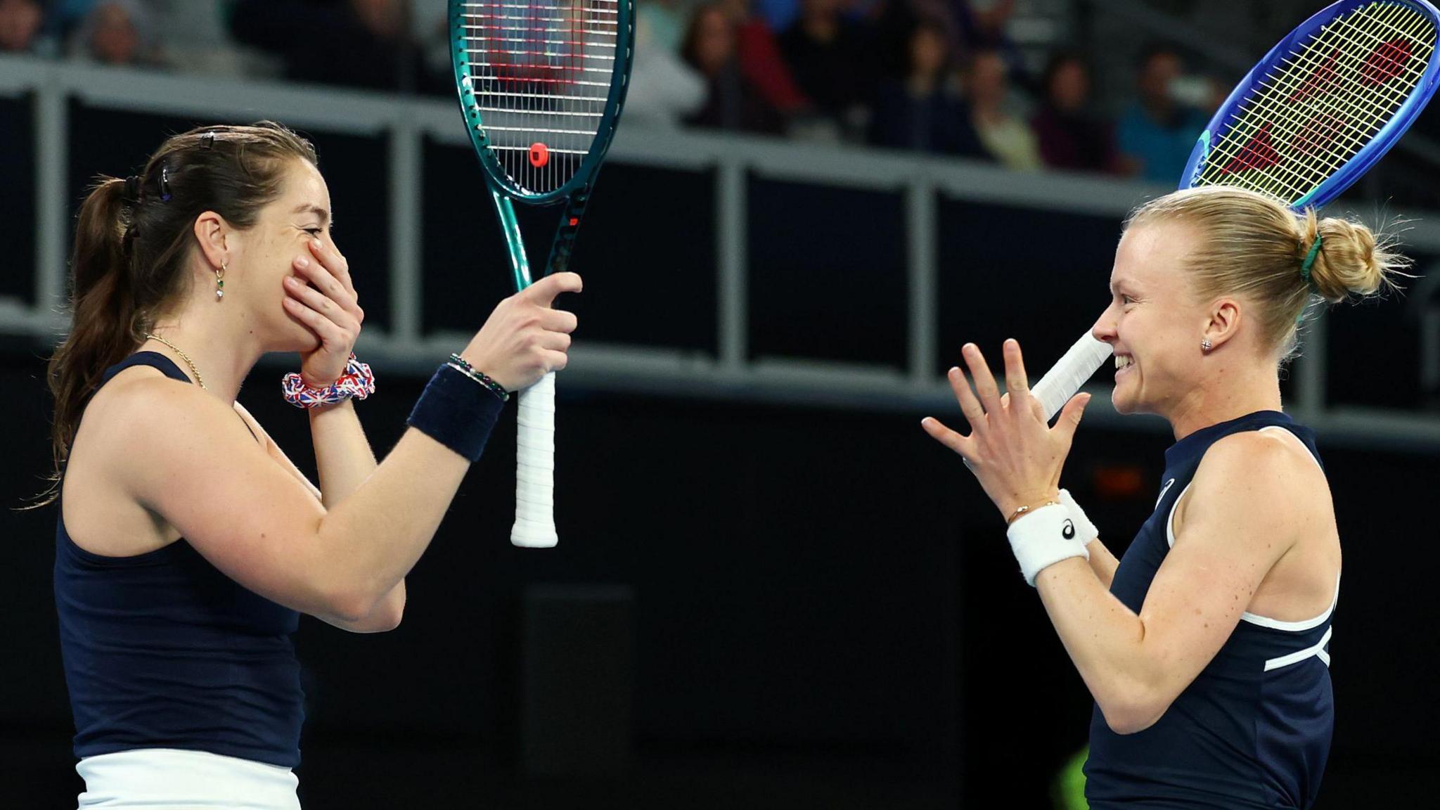Harriet Dart and Jodie Burrage celebrate securing Great Britain's place at the BJK Cup finals