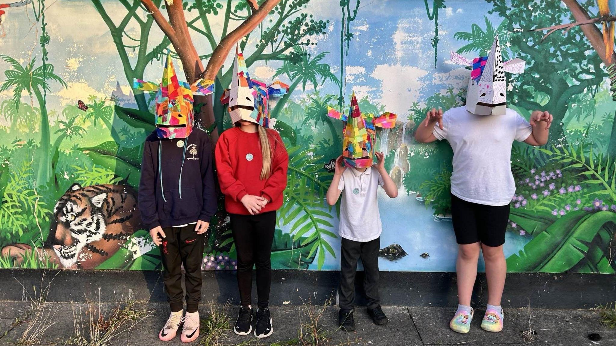 children wearing their masks prepared for the parade