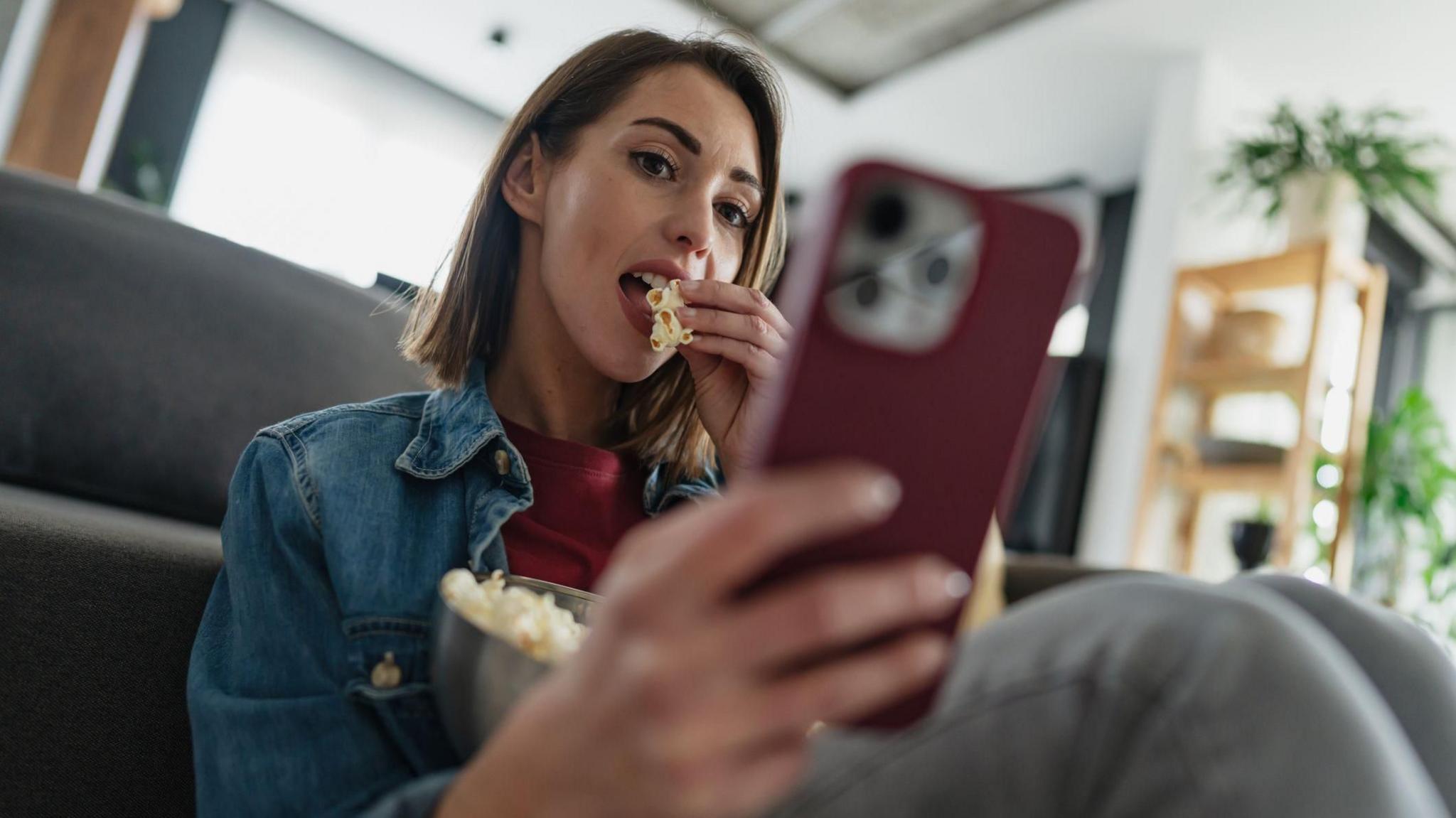 Stock photo of woman on smartphone.
