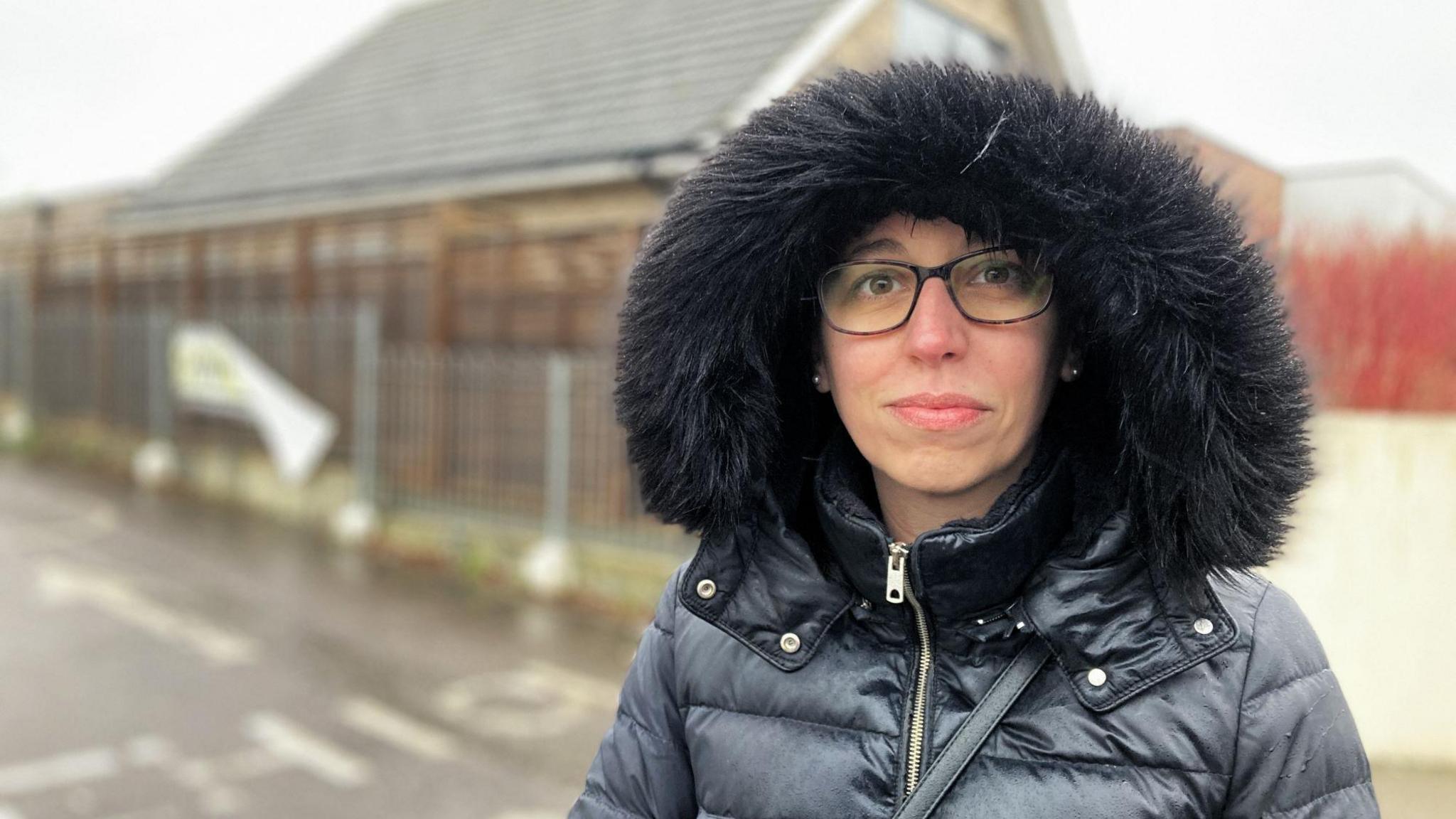 Sara Caetano standing outside the school gate