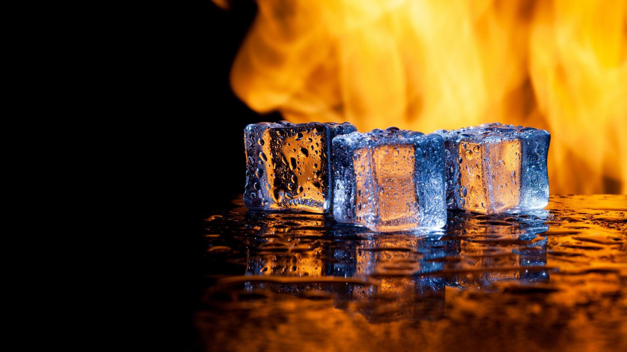 ice cubes with flames in the background