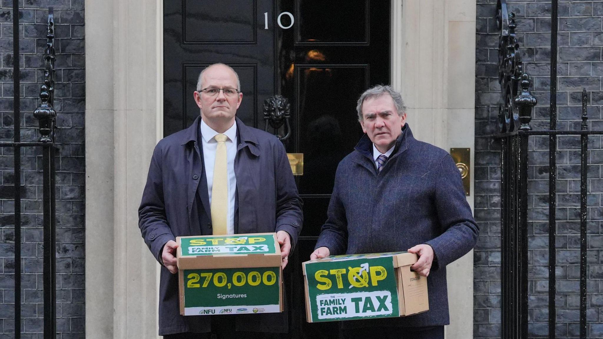 National Farmers' Union (NFU) president Tom Bradshaw (left) and NFU Cymru president Aled Jones handing in a petition at 10 Downing Street, central London, over the changes to inheritance tax (IHT) rules in the recent budget which introduce new taxes on farms worth more than £1 million