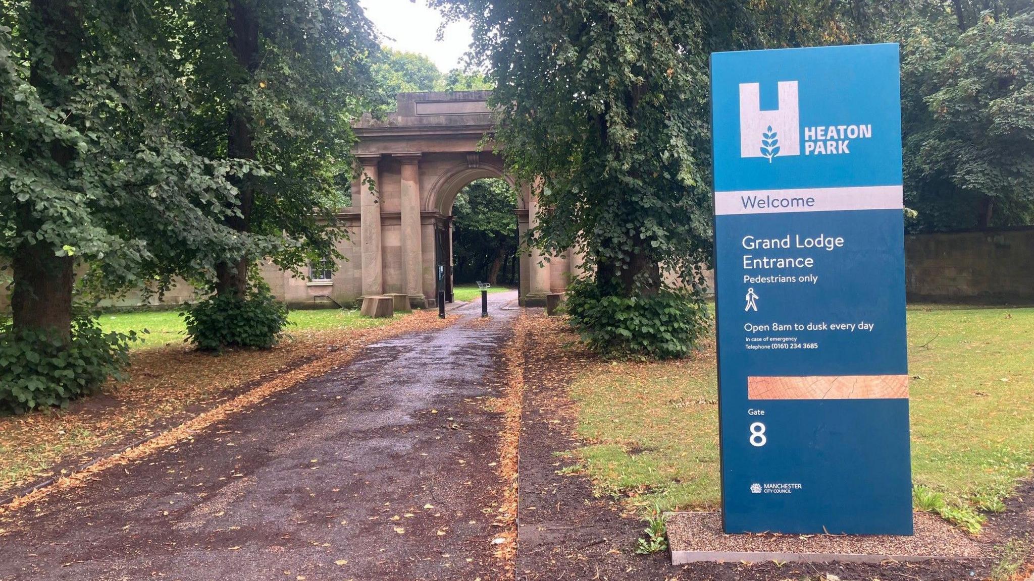 A view of a walking route through a triumphal arch into Heaton Park 