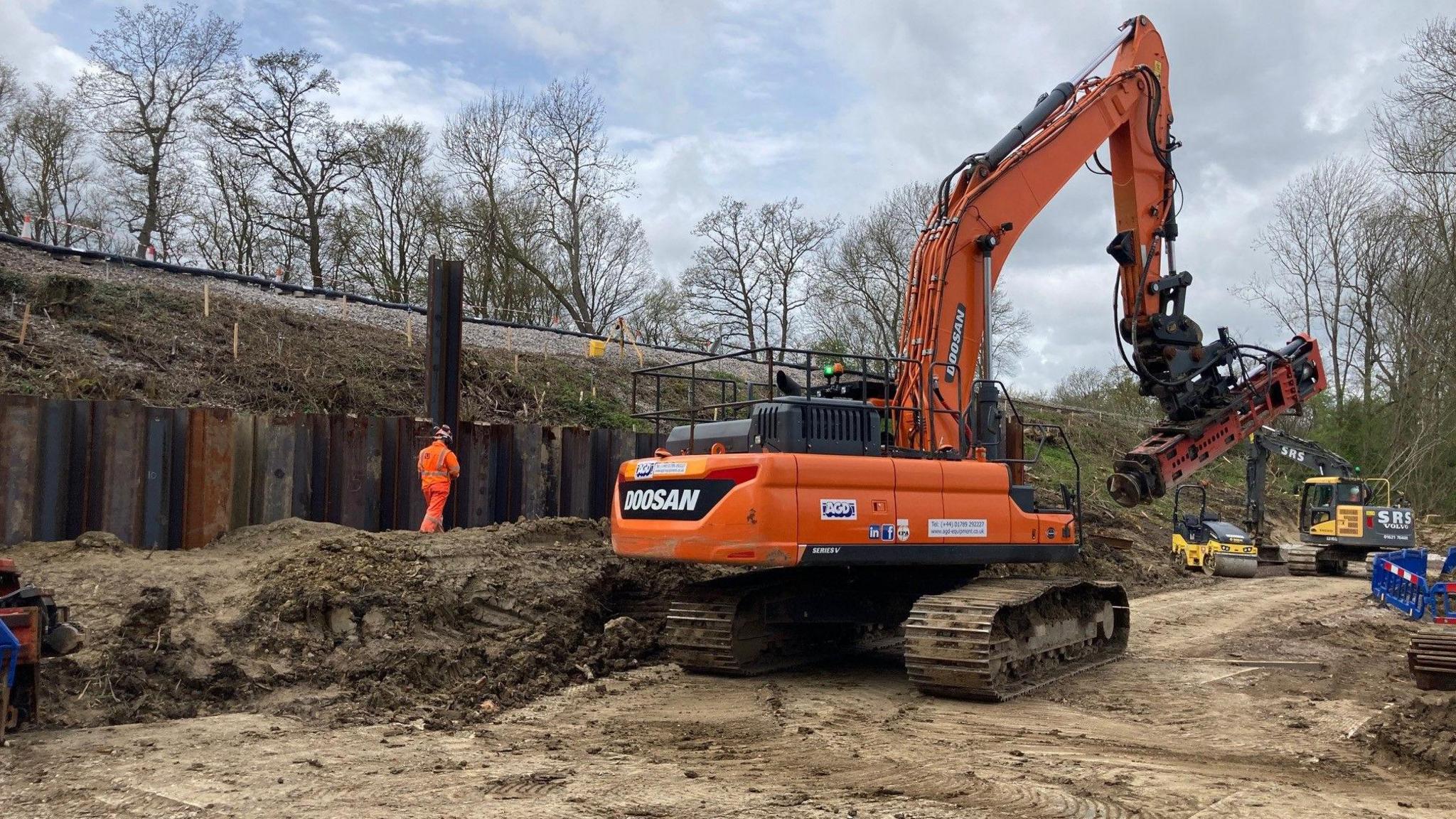 A crane installing the piles at the bottom of the Bough Beach embankment