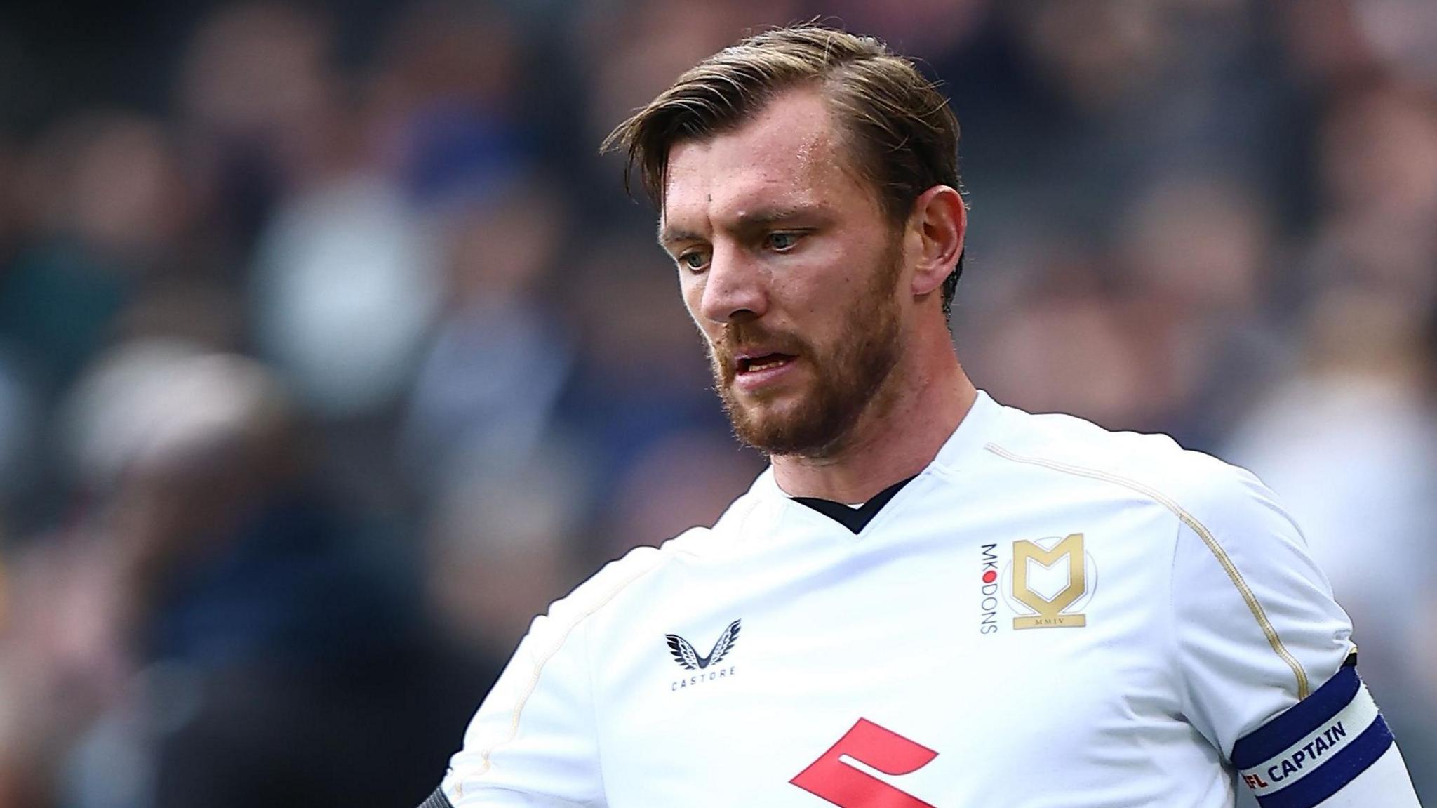 Alex Gilbey playing for MK Dons 