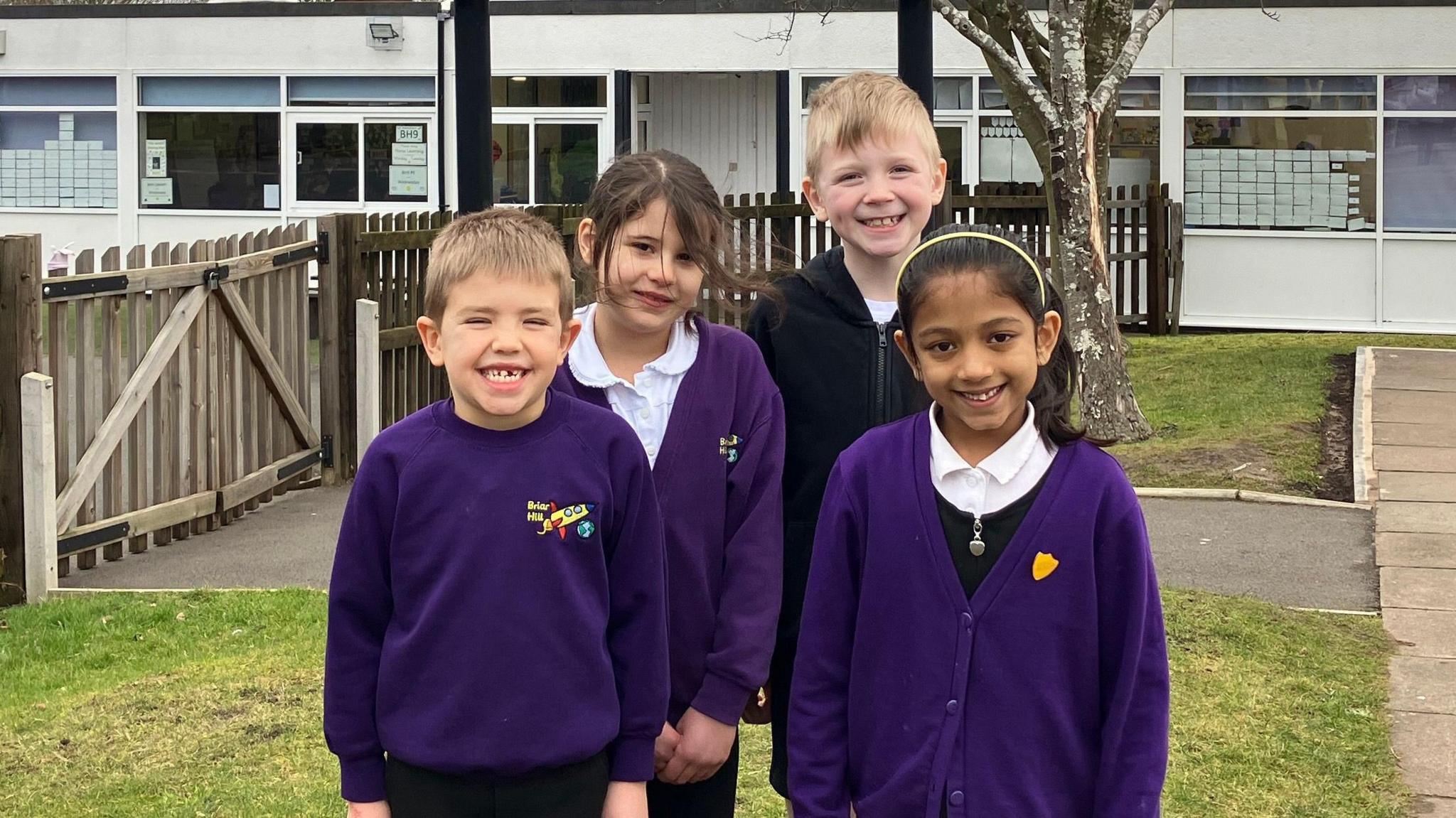 Children stand outside Briar Hill Infant School