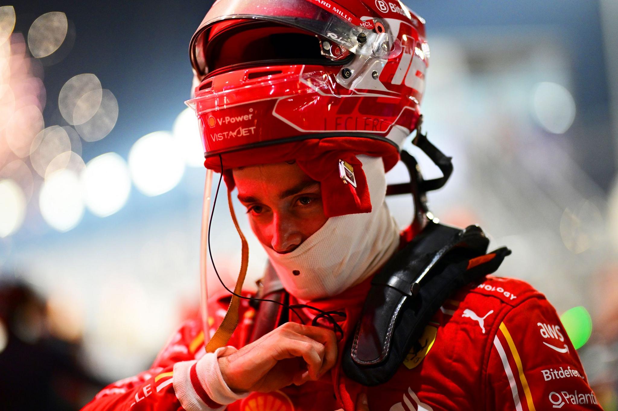 Second placed Charles Leclerc of Monaco and Ferrari looks on in parc ferme during the F1 Grand Prix of Qatar at Lusail International Circuit.