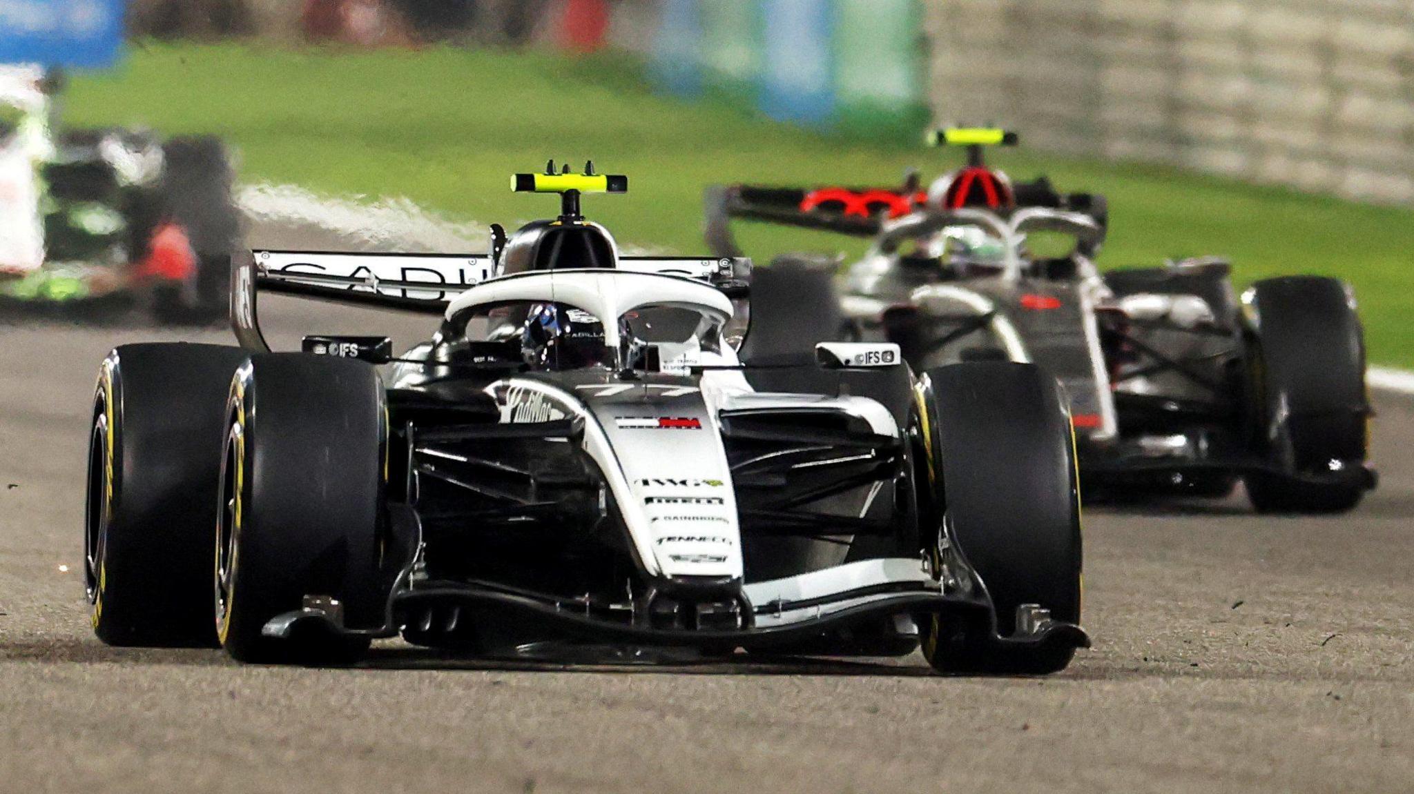 Valtteri Bottas in a Cadillac ahead of Gabriel Bortoleto in an Audi during F1 pre-season testing in Bahrain