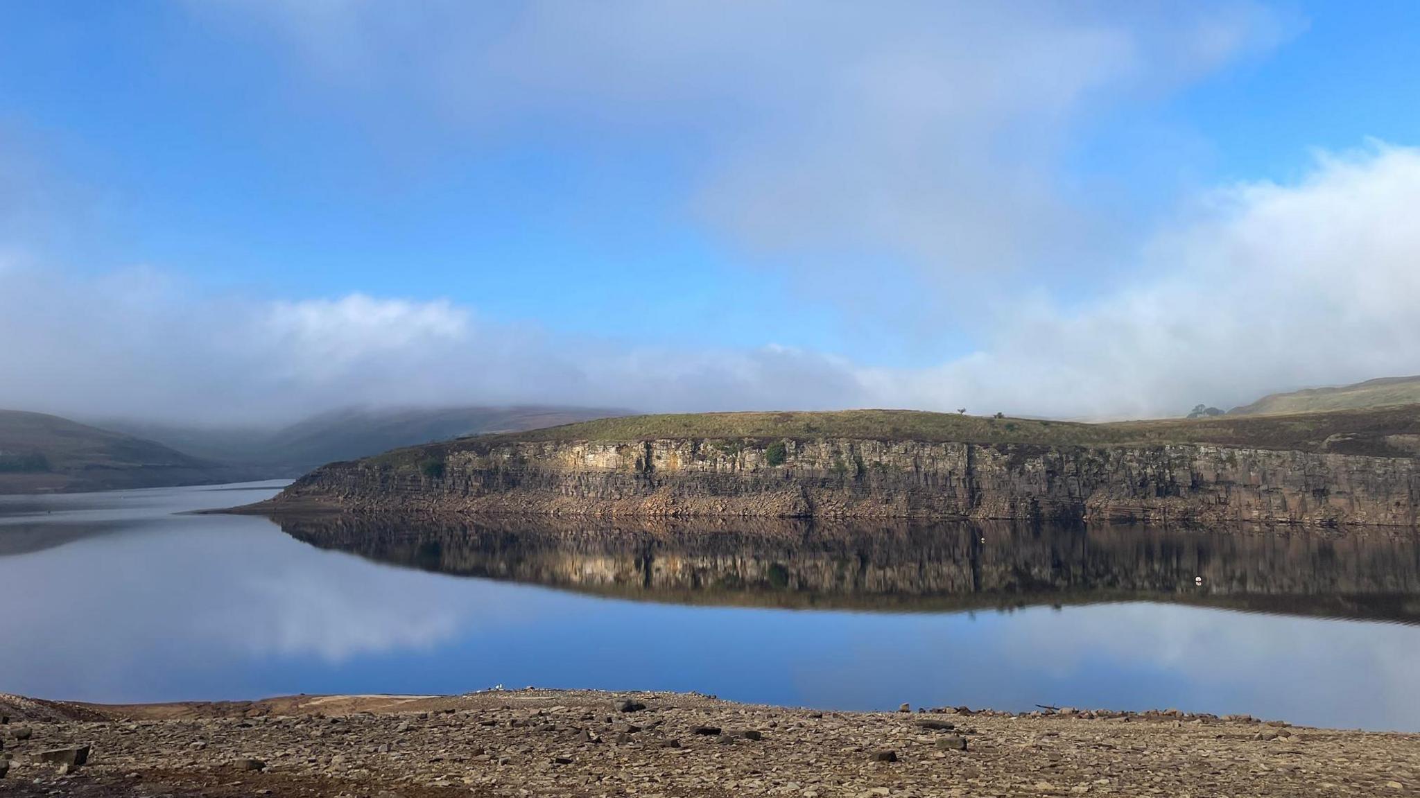 Winscar Reservoir, is a compensation reservoir on the headwaters of the River Don in South Yorkshire, England. The image shows the reservoir appears to be fuller than during the summer months