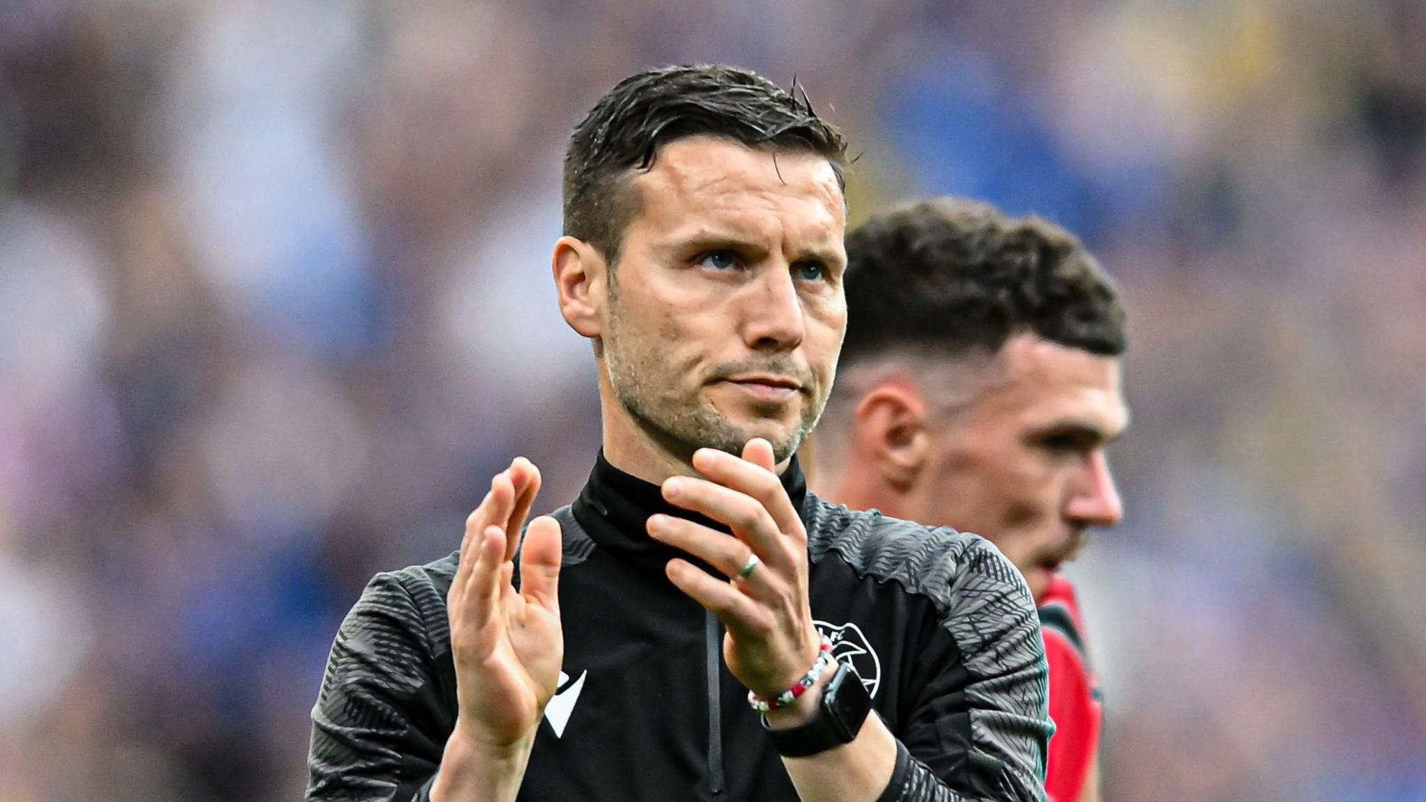 Mat Sadler applauding fans after Walsall's play-off final loss to AFC Wimbledon