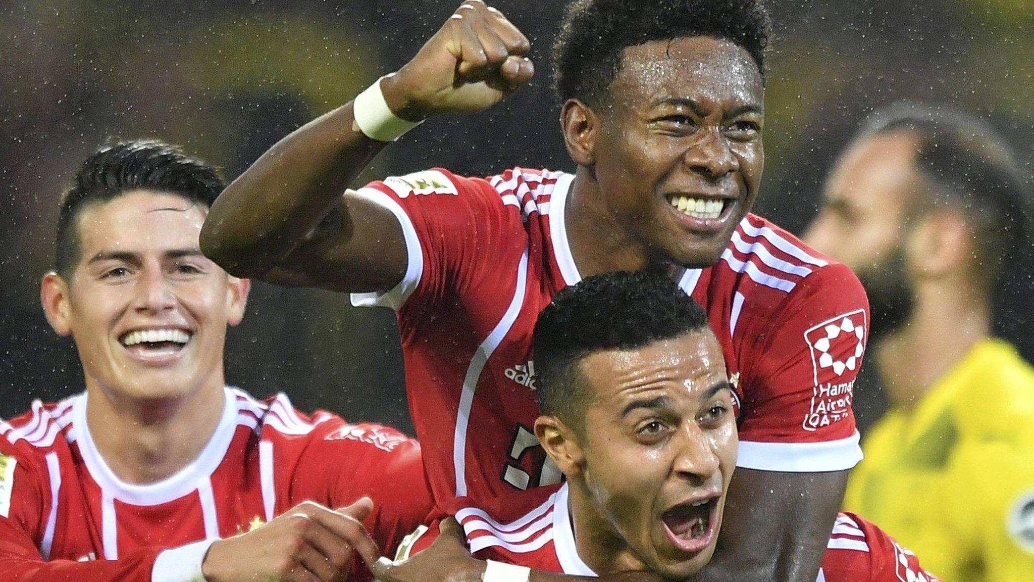 Bayern Munich's players celebrate scoring against Borussia Dortmund