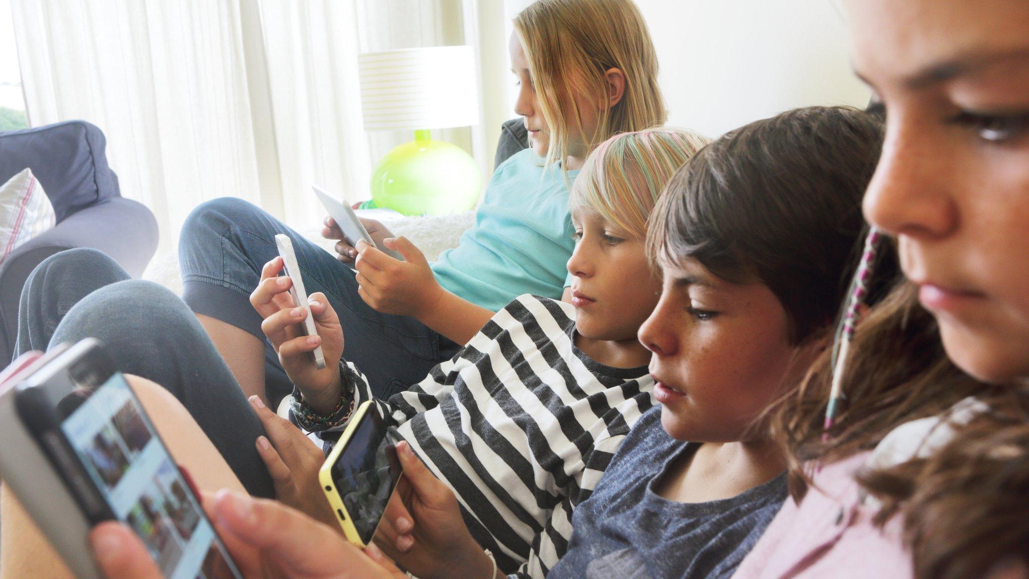 Children looking at tablets