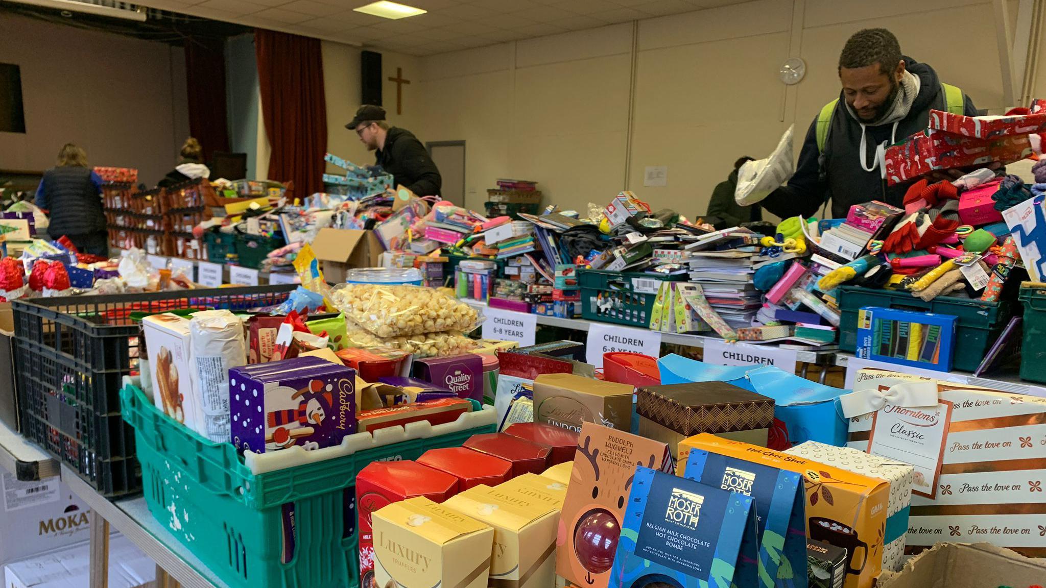 Volunteers packing shoeboxes