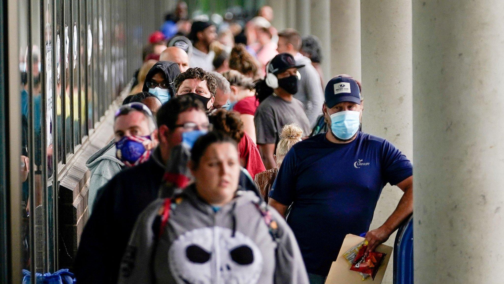 Hundreds of people line up outside a Kentucky Career Center hoping to find assistance with their unemployment claim in Frankfort, Kentucky, U.S. June 18, 2020.