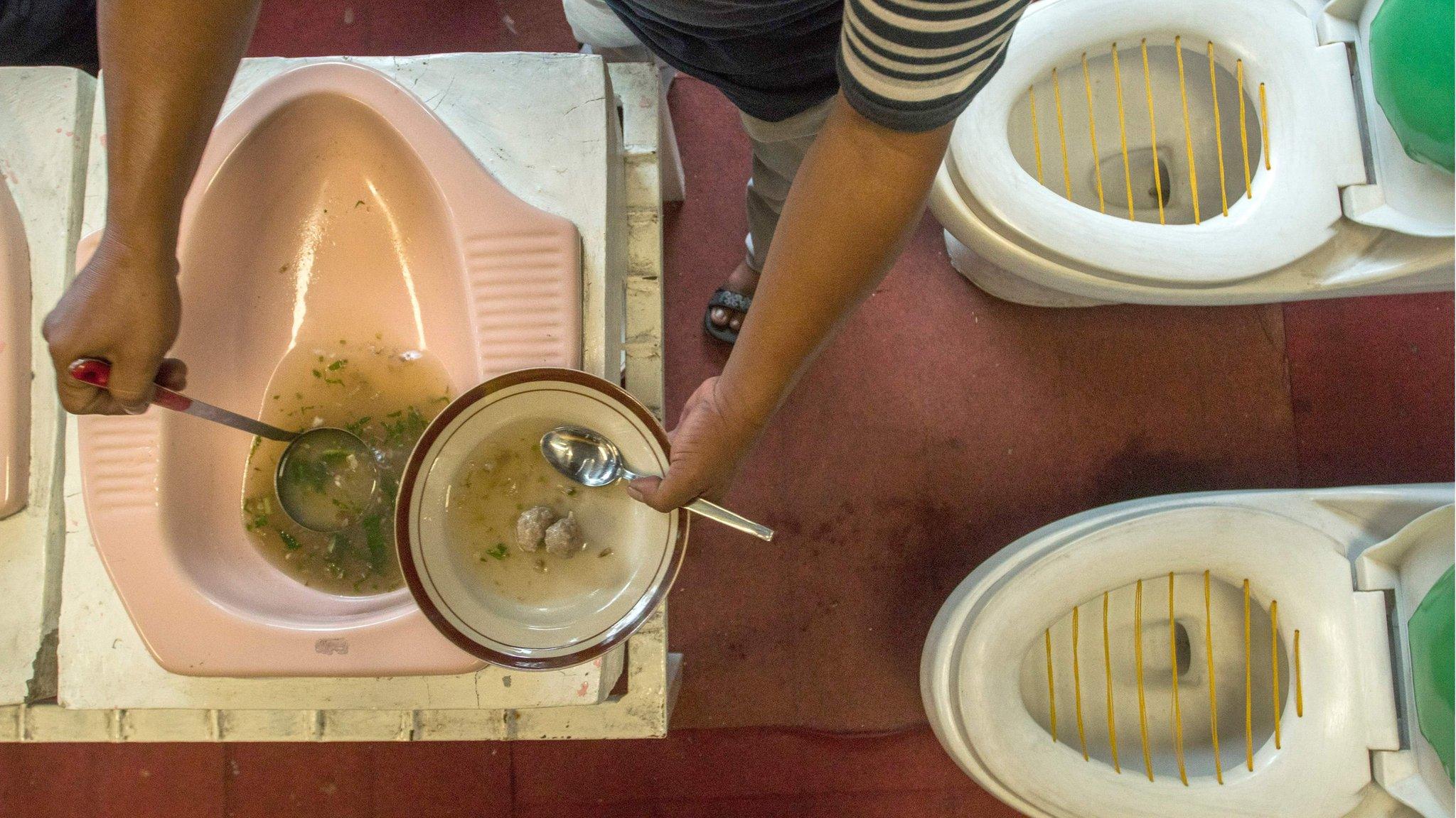 The chef serves meatball stew from a toilet pan at the Toilet Cafe