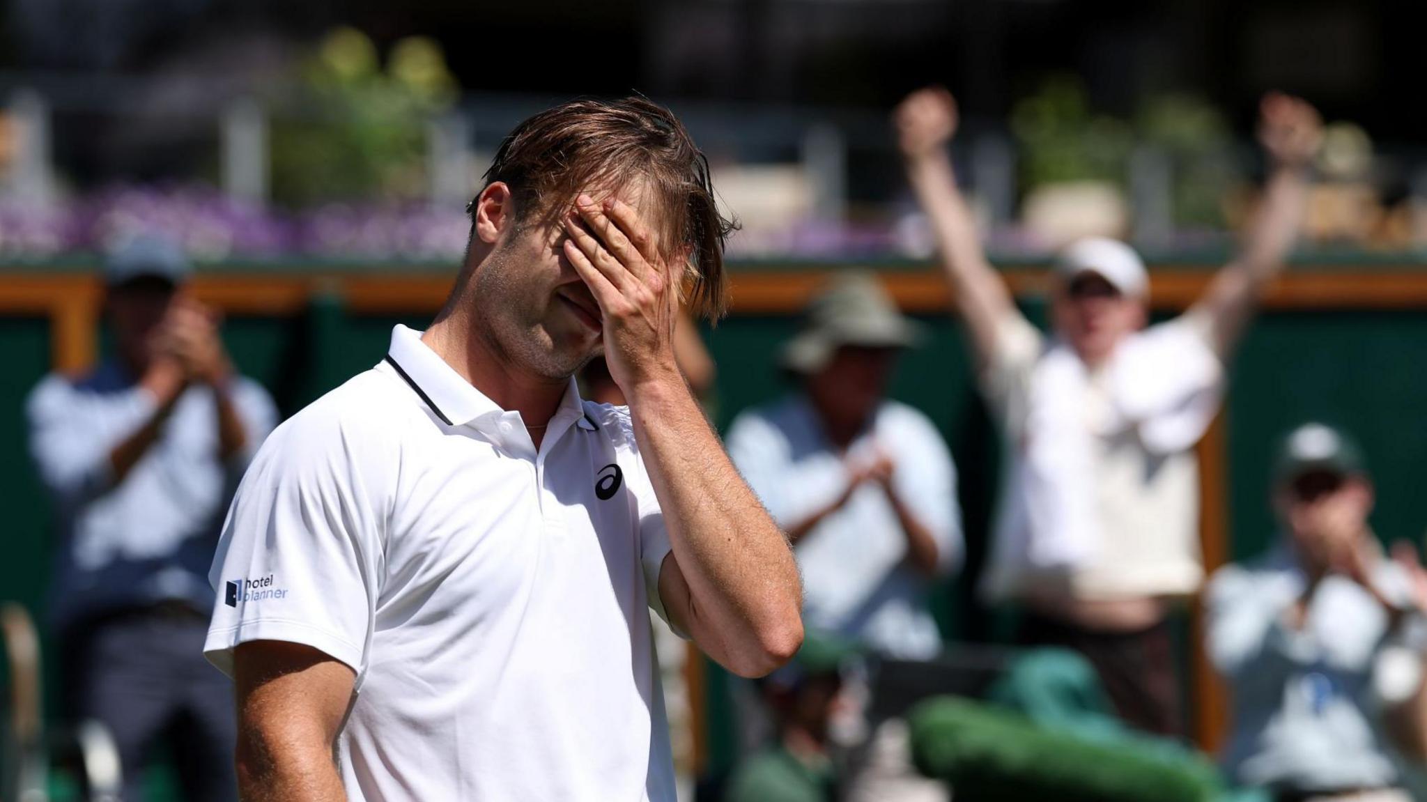 Arthur Fery covers his face as he celebrates winning at Wimbledon
