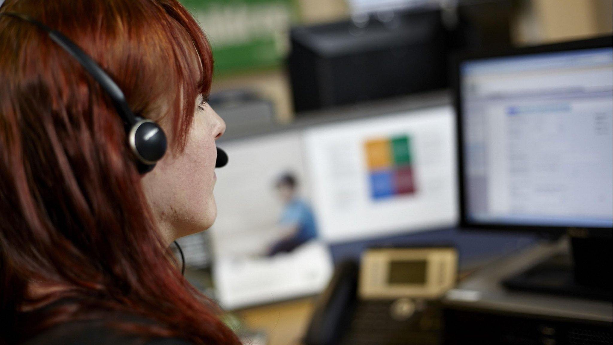 An NSPCC worker with a telephone headset