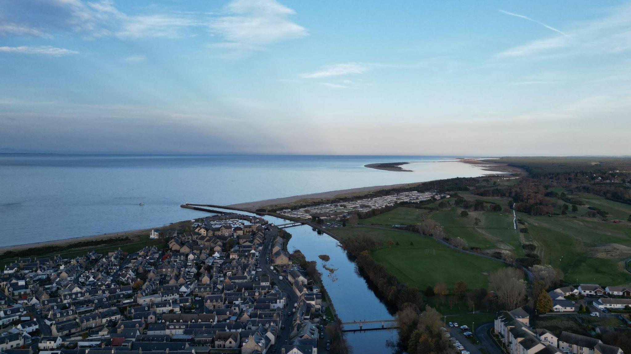 An aerial view of the town of Nairn, its river and beaches on the Moray Firth.