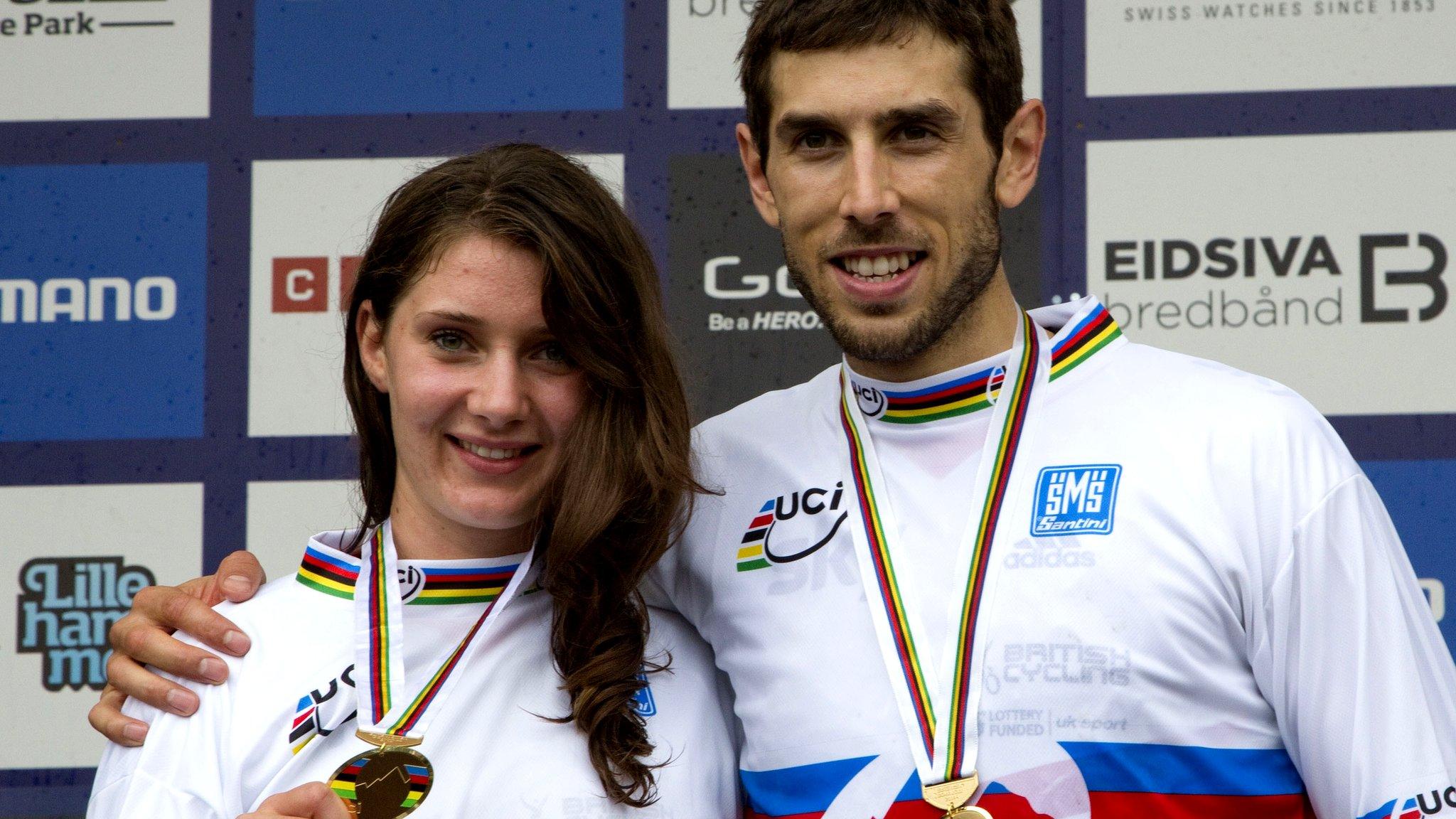 Gee Atherton (R) and Manon Carpenter celebrate winning the Elite Downhill class of the 2014 UCI Mountain Bike & Trials World Championships