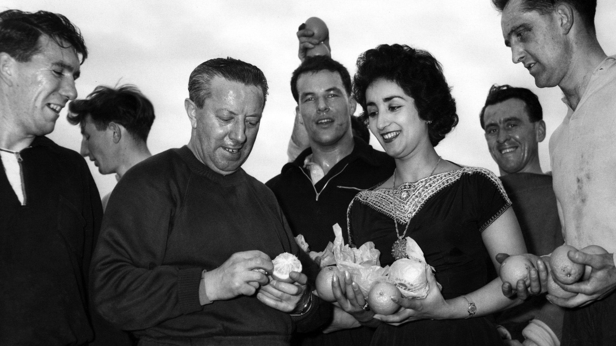 Wales' players and coaches are presented with Israeli oranges