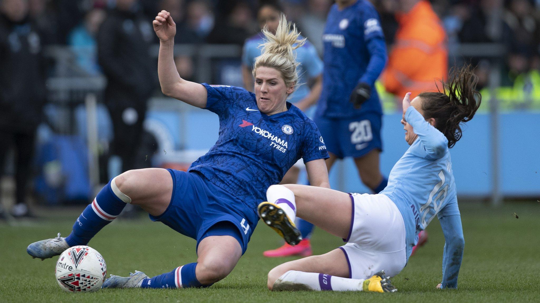 Chelsea player Millie Bright (left) and Manchester City's Caroline Weir (right) challenge for the ball during a Women's Super League game