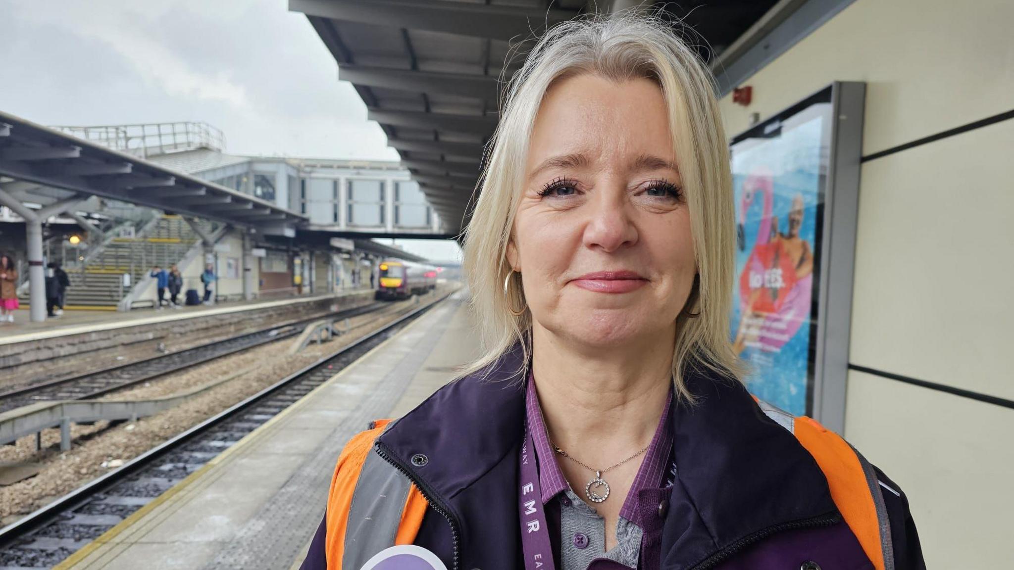 Sara Hardstaff standing on the platform at Derby Railway Station