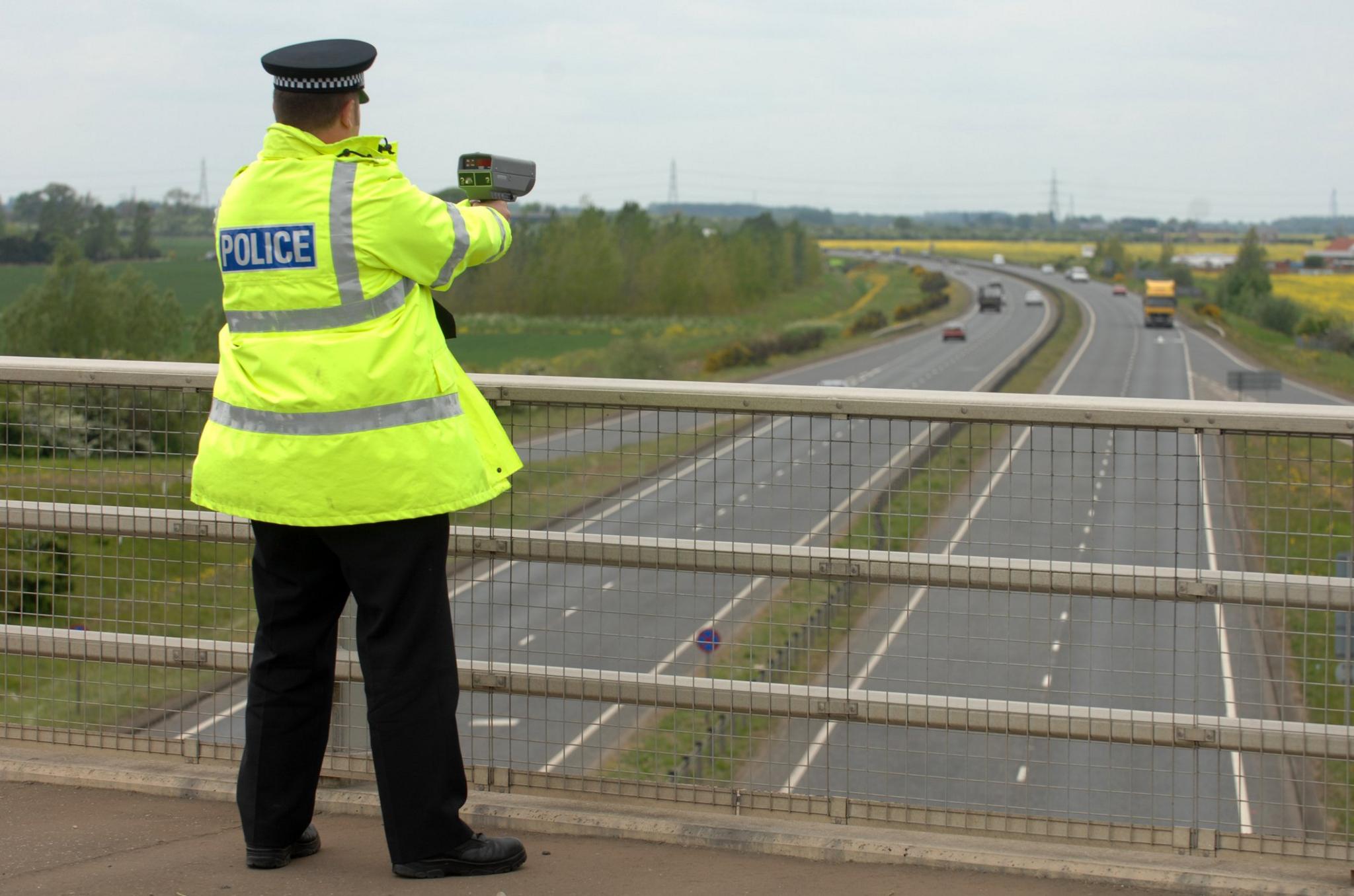 Police officer with speed gun