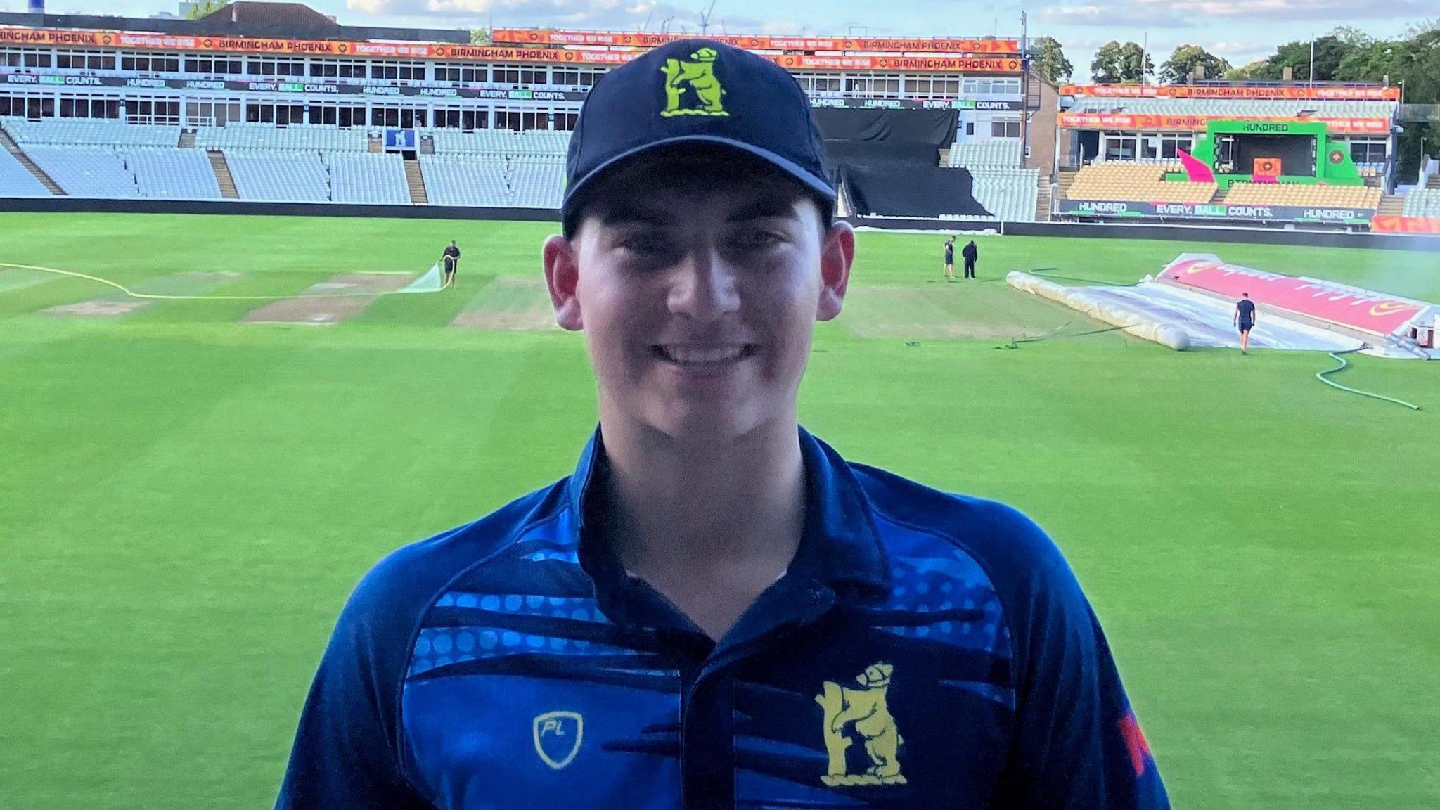 Kai Smith poses in the Edgbaston pavilion after his match-winning century