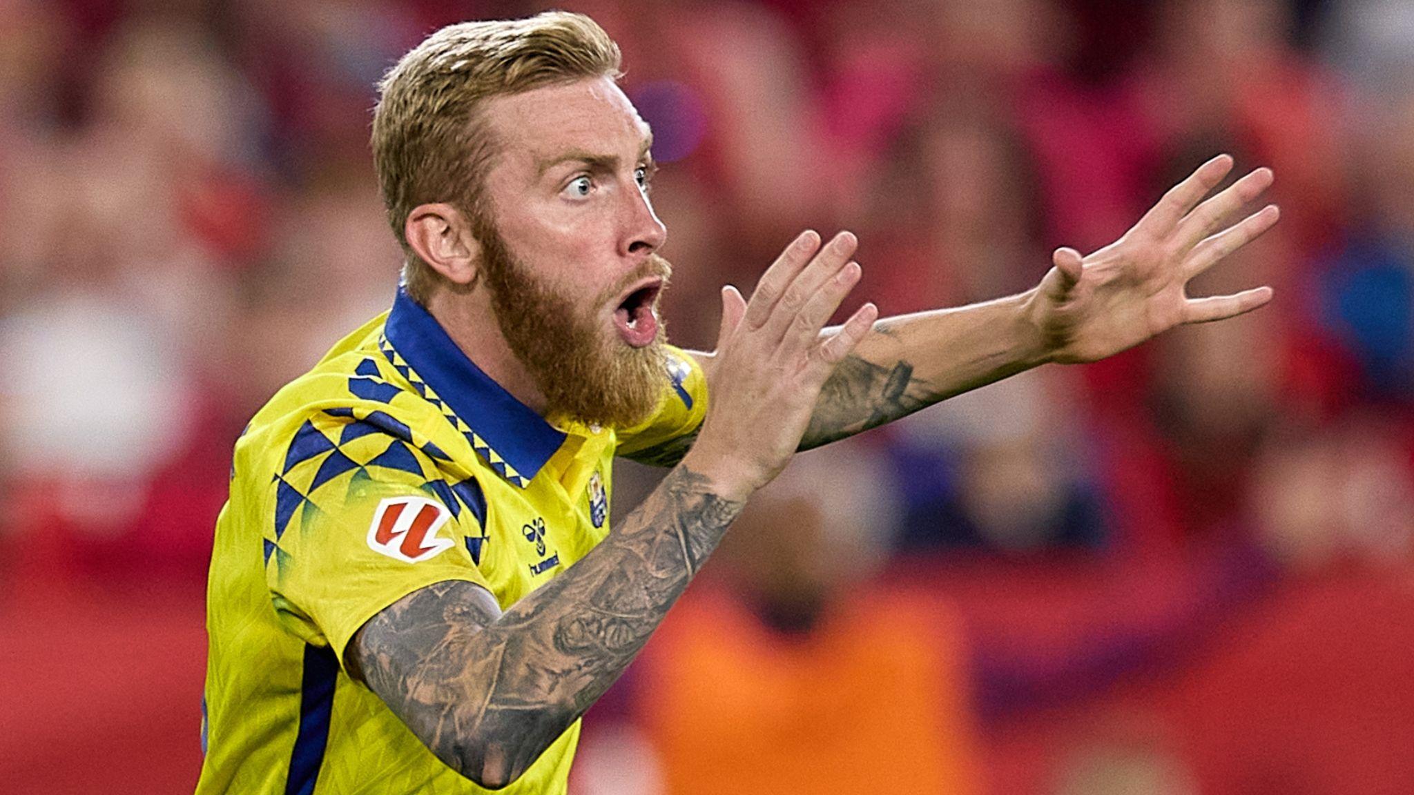 Oli McBurnie shouts with arms outstretched