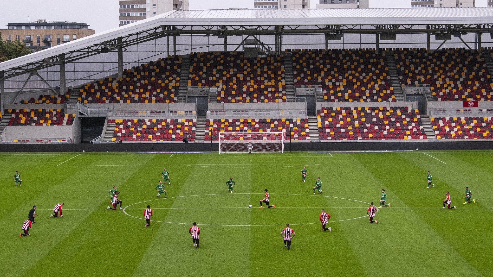 Brentford players taking the knee