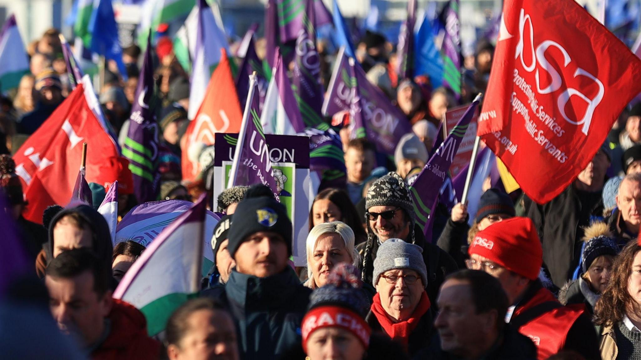 Public sector workers walk from the picket line at the Royal Victoria Hospital to a rally at Belfast City Hall, as an estimated 150,000 workers take part in walkouts over pay across Northern Ireland