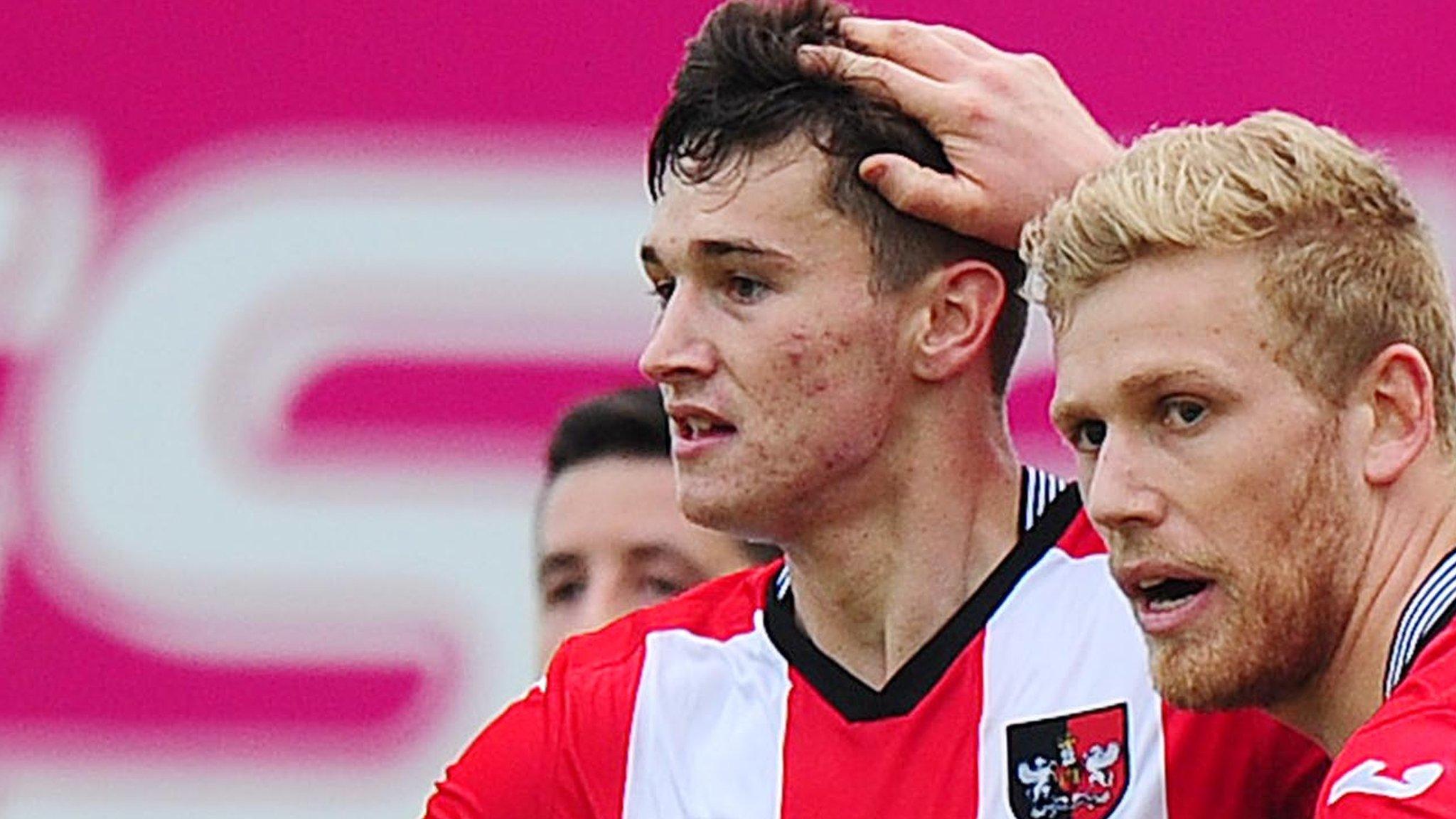 Jordan Storey is congratulated after scoring for Exeter City