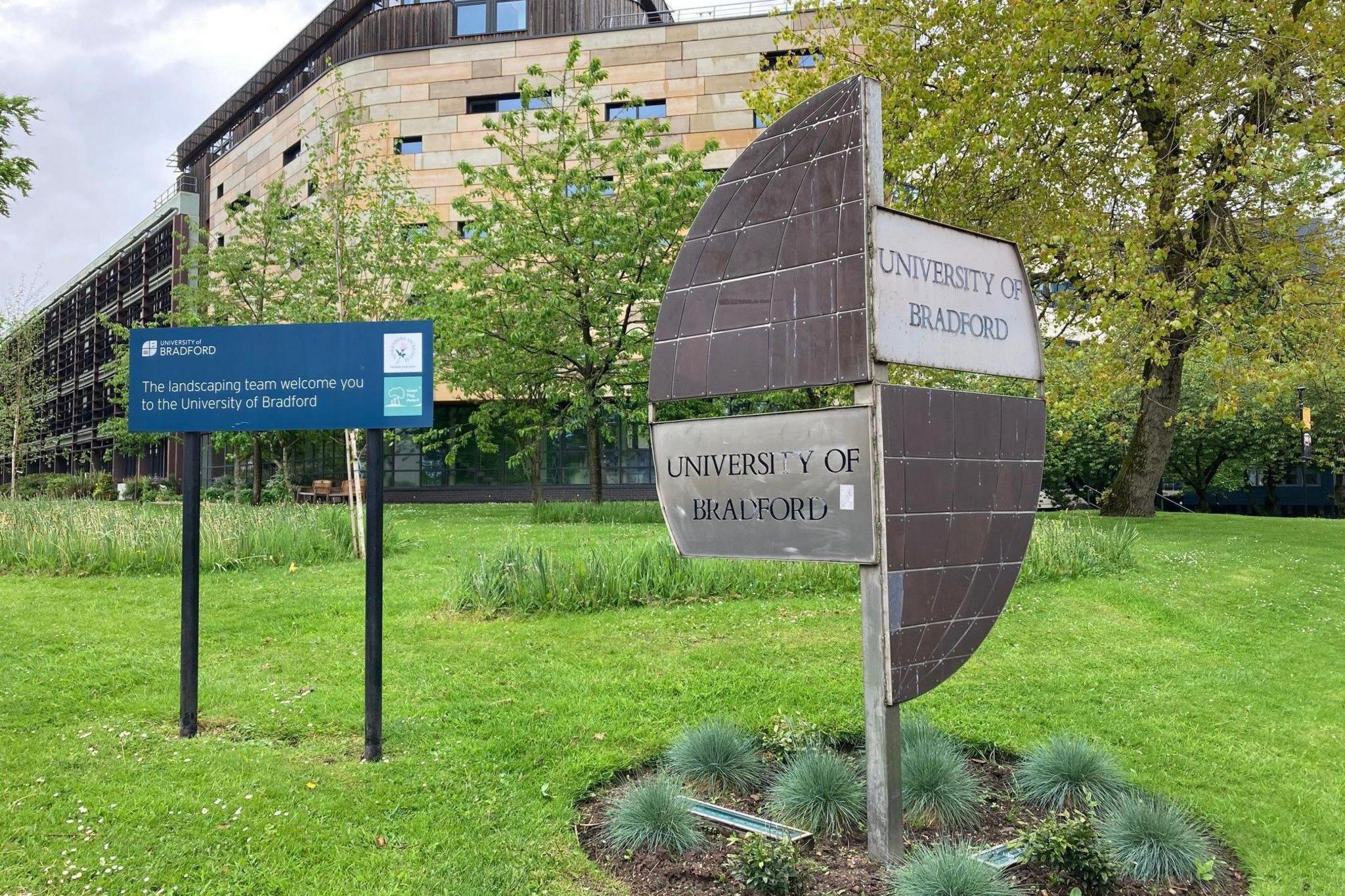 A University of Bradford sign at the campus entrance