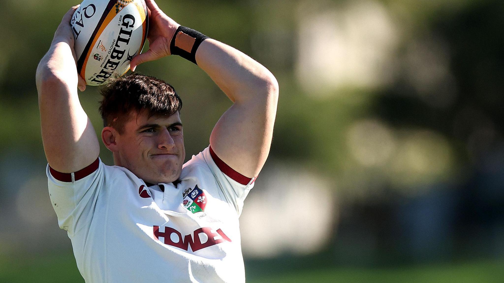 Dan Sheehan throwing a ball while at a Lions practice session in Australia