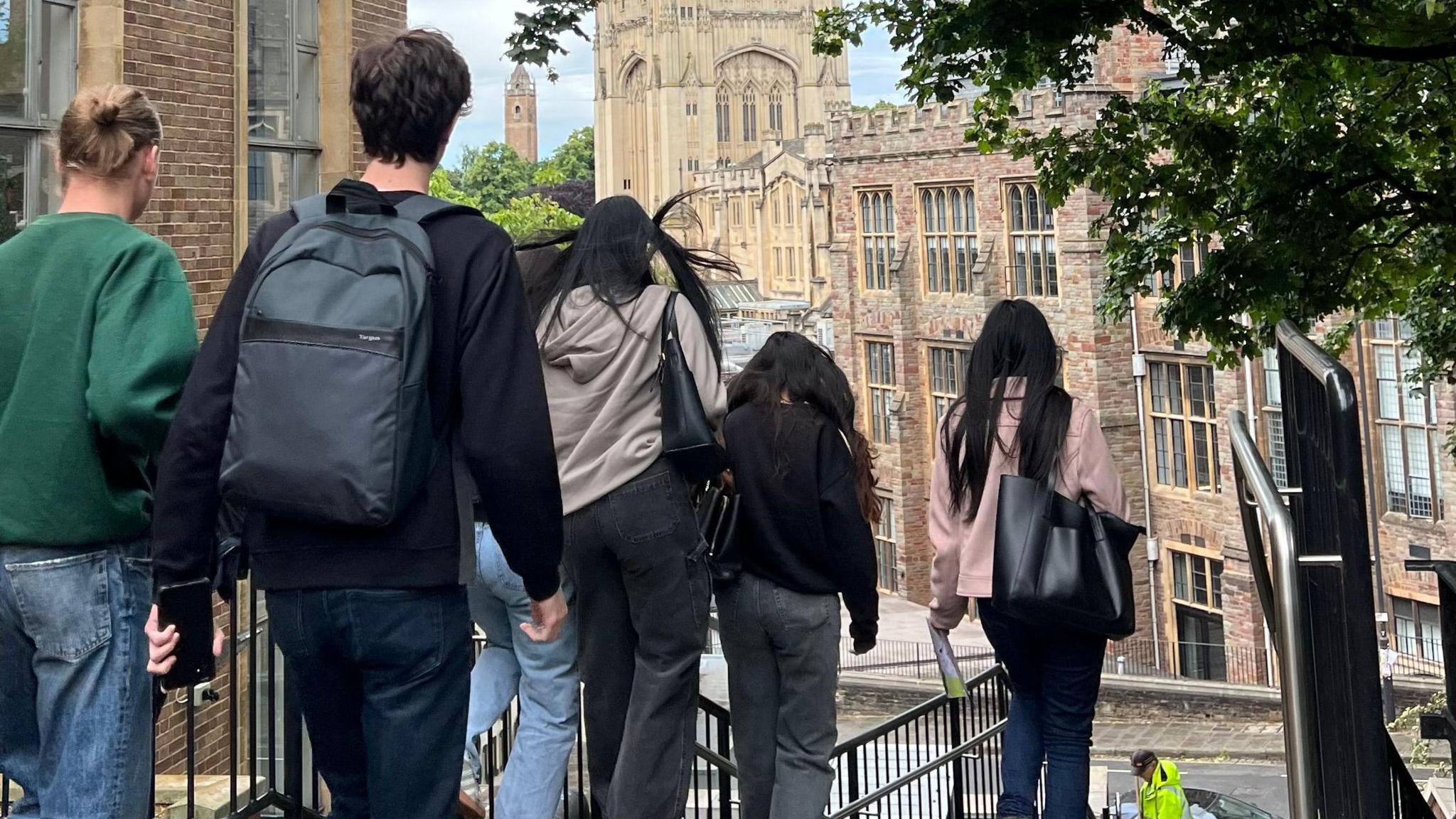 Students walking down steps with the Wills Memorial Building in the background