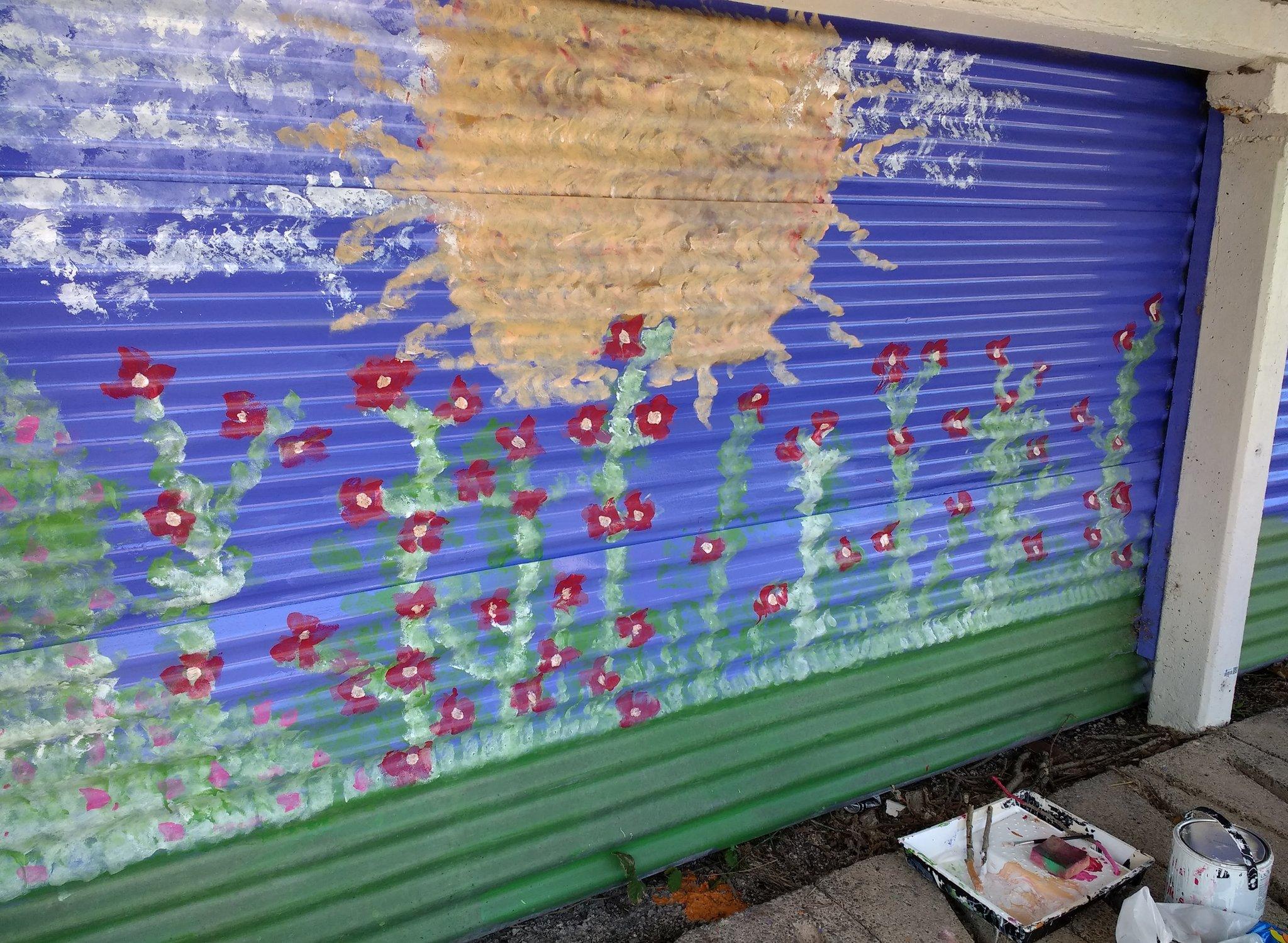 Sun and flowers painted on roller blinds at Green Road train station near Millom, Cumbria