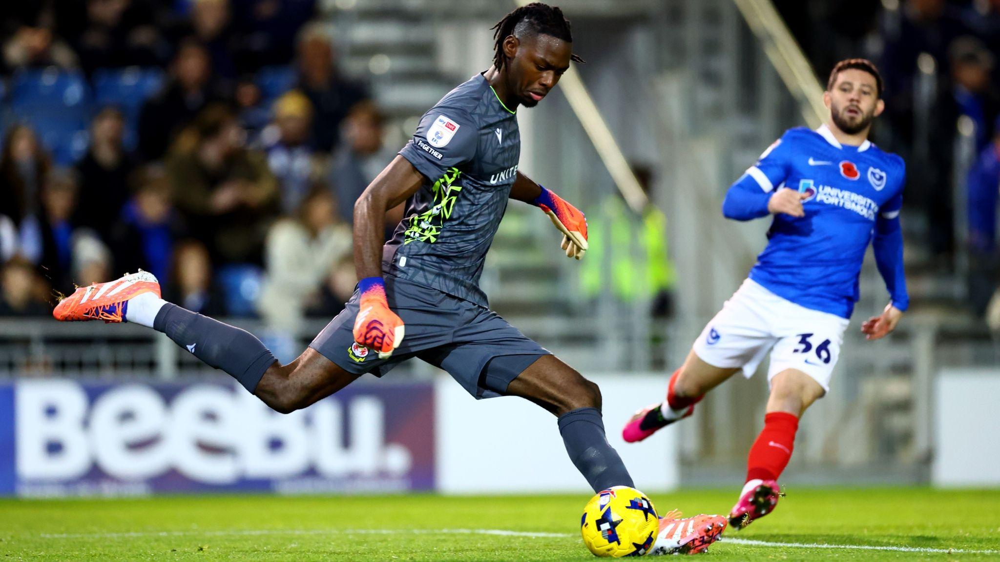 Goalkeeper Arthur Okonkwo kicks to clear