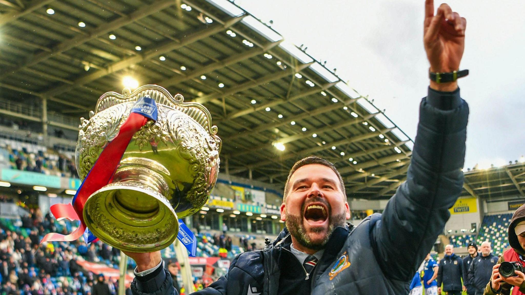 David Healy celebrates with trophy